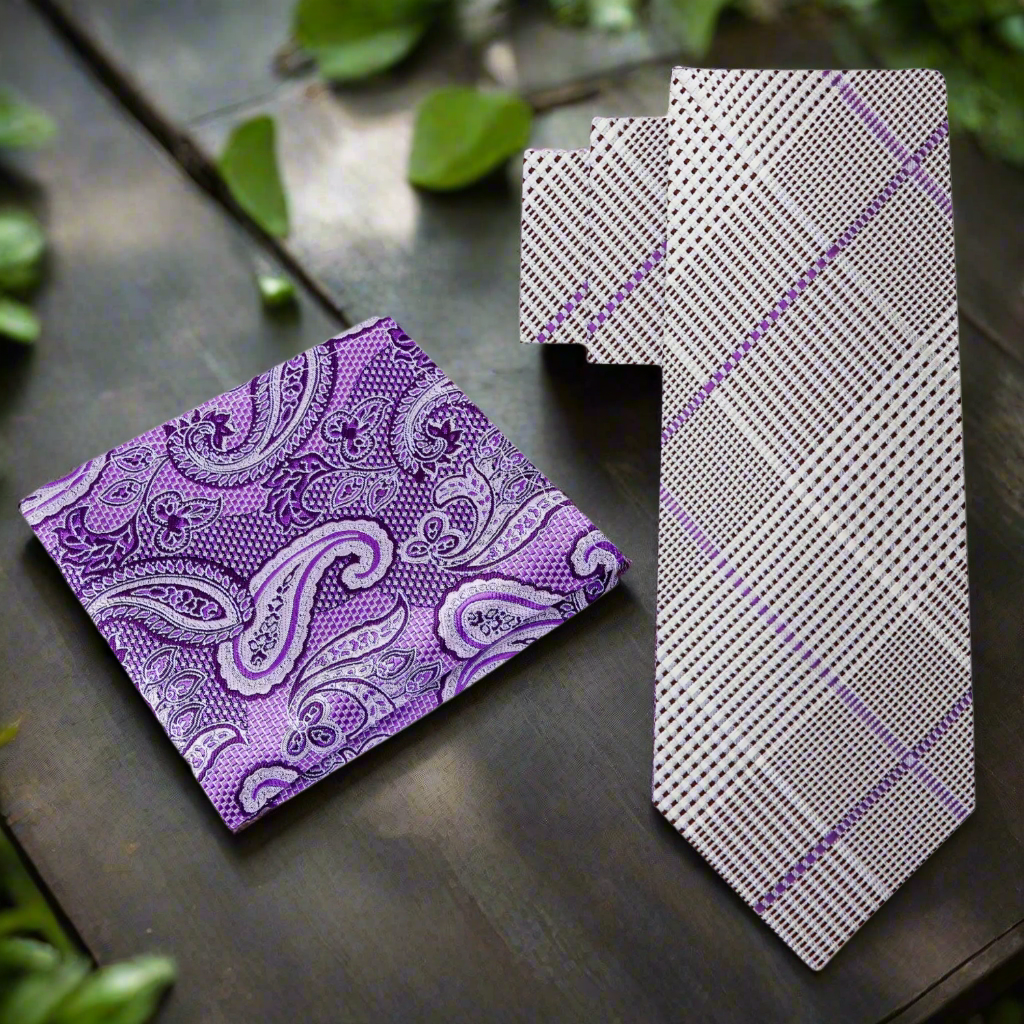 Close-up of grey and purple silk plaid necktie folded neatly with pocket square