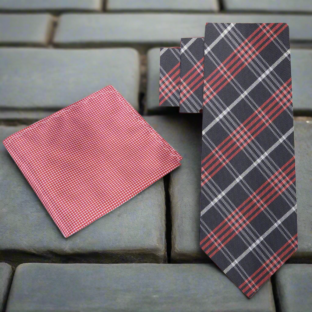 Close-up of a plaid necktie knot, highlighting the luxurious silk fabric
