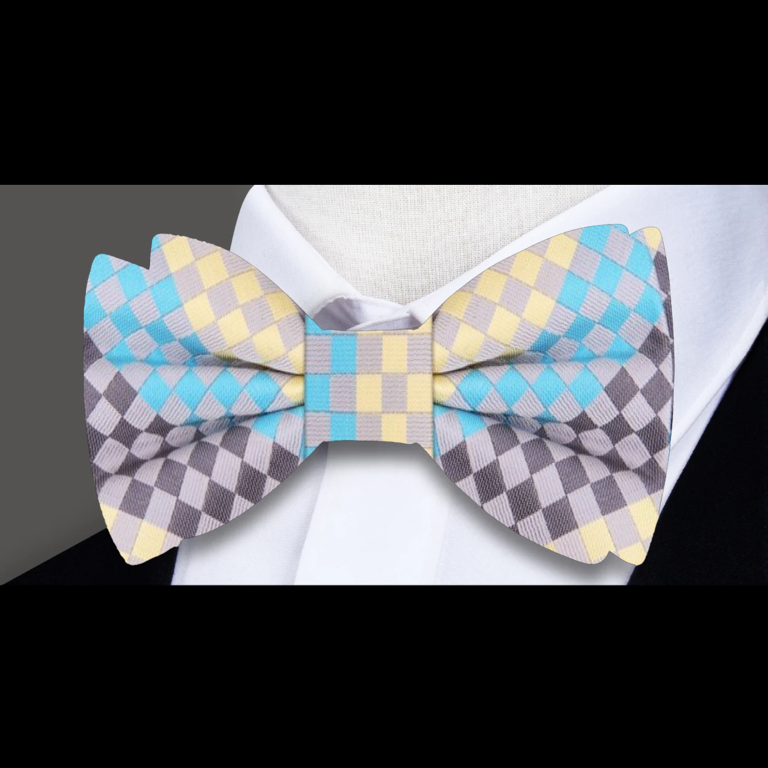 Close-up of a silk bow tie with matching pocket square in vibrant colors