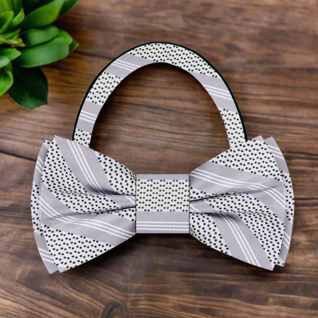 Elegant purple striped silk bow tie displayed against a solid white dress shirt for networking events.
