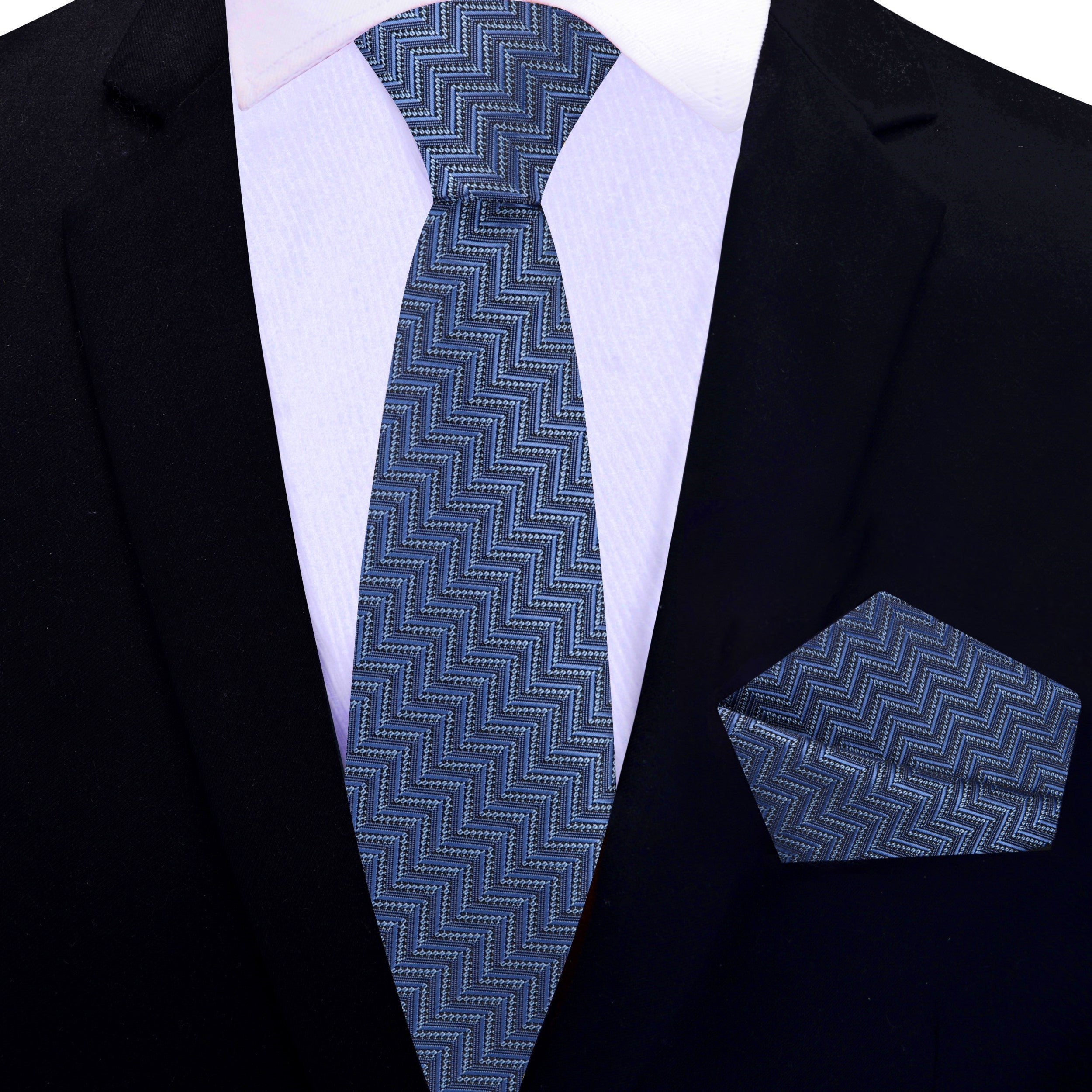 Close-up of the silk fabric and geometric chevron design on the necktie