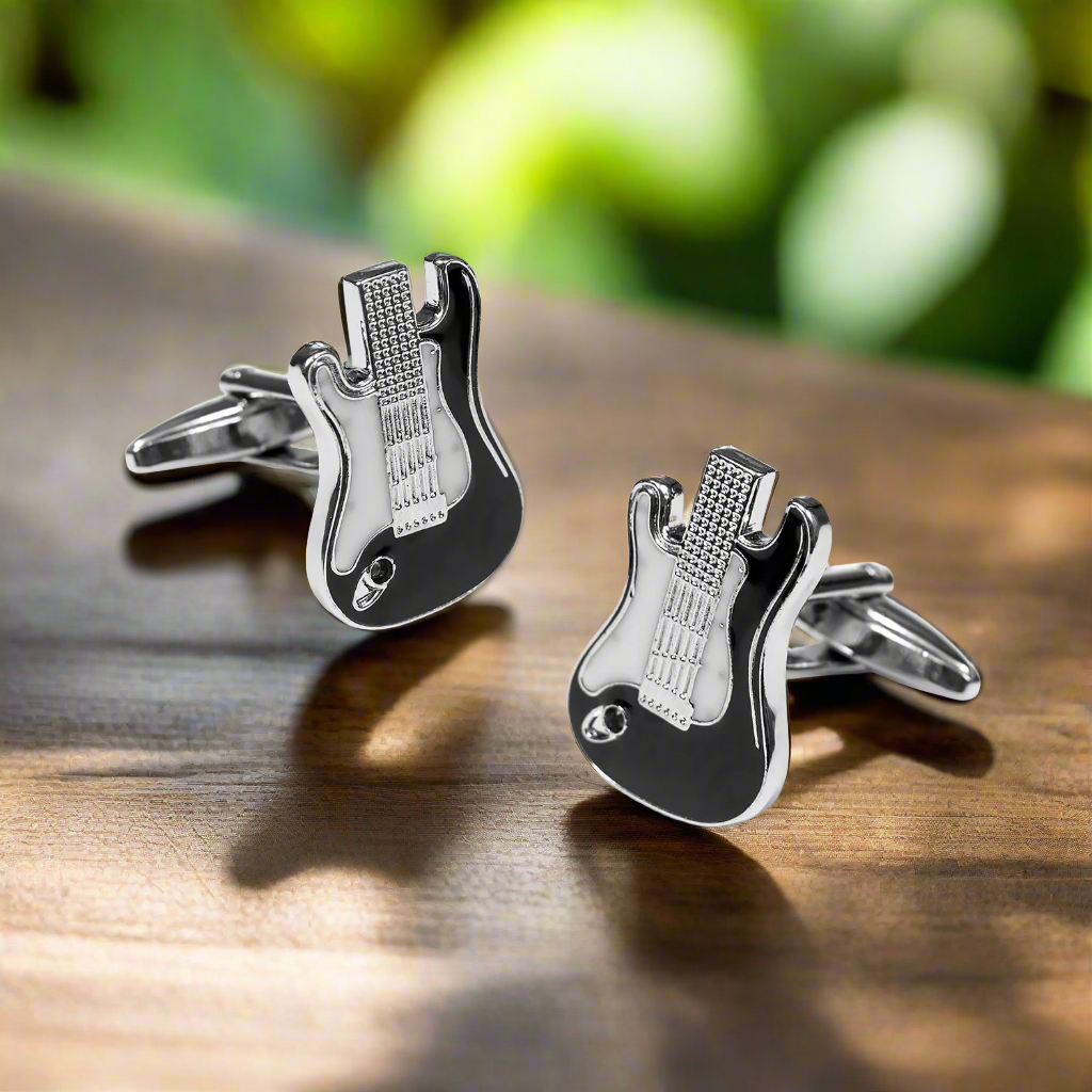 Complete guitar cufflinks and tie bar set displayed elegantly on a grey suit.