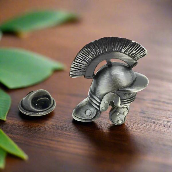 Vintage Roman helmet lapel pin on a white dress shirt for a stylish look