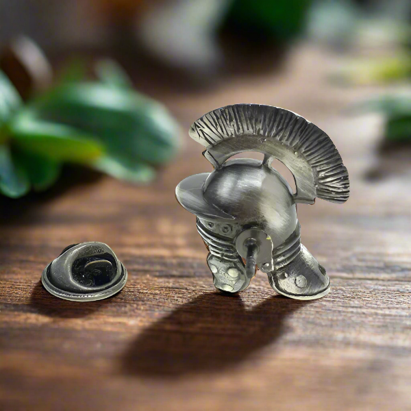 Fashionable man wearing the Roman helmet lapel pin at a cultural exhibition