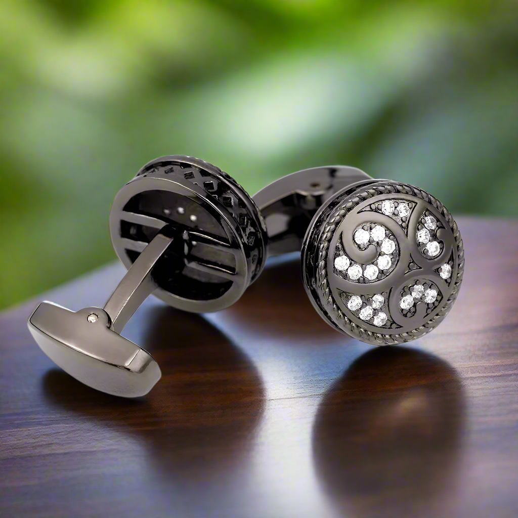 Gold cufflinks highlighting a beige suit, emphasizing their luxurious design.