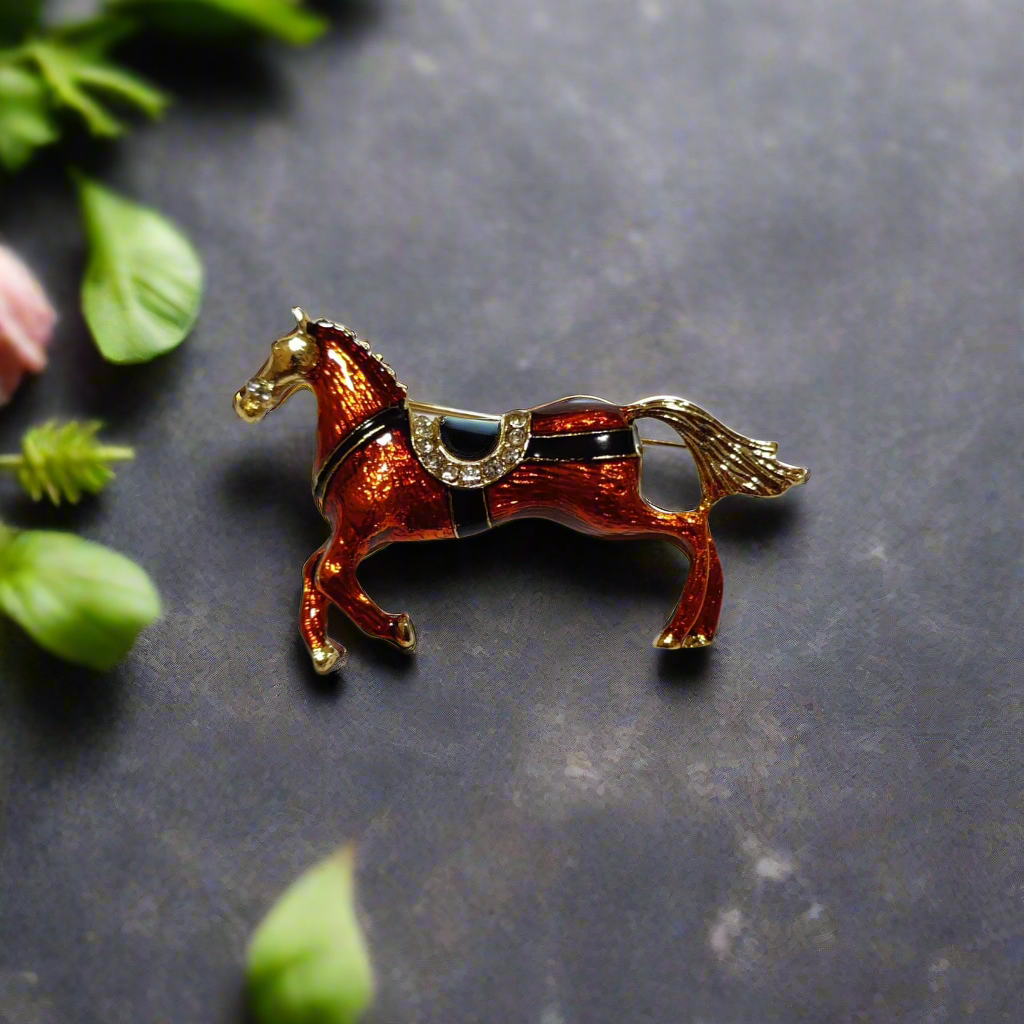 Close-up view of rustic horse lapel pin showing detailed craftsmanship and earthy tones