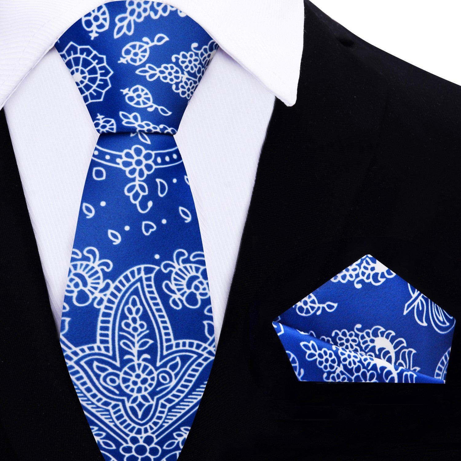 Close-up of the red paisley silk necktie showcasing its intricate bandana pattern.