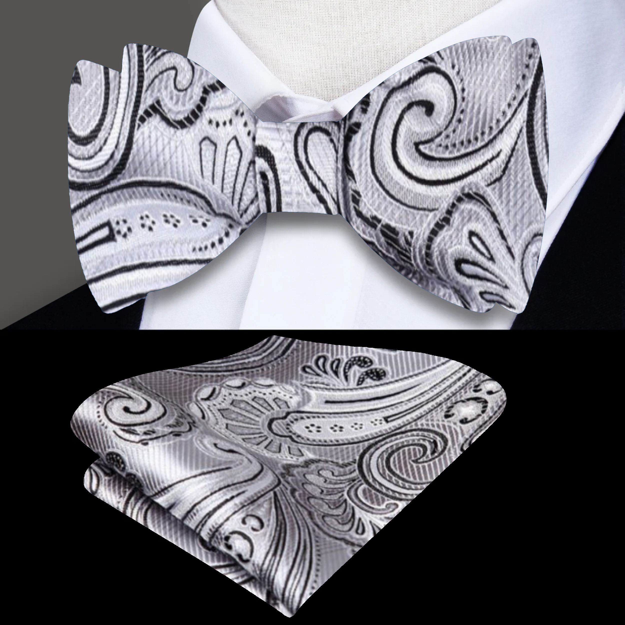 Elegant model wearing the Grey and Black Paisley Bow Tie with a white dress shirt.