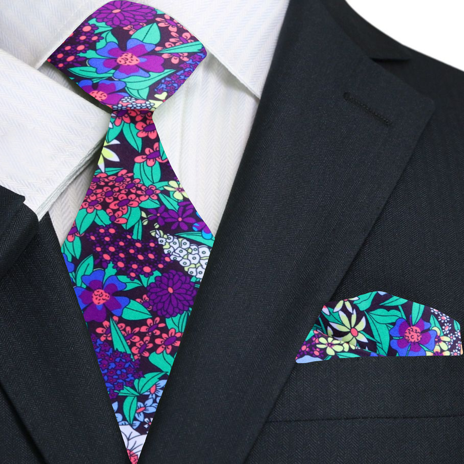 Close-up of vibrant floral silk tie with botanical pattern in green, purple, and pink