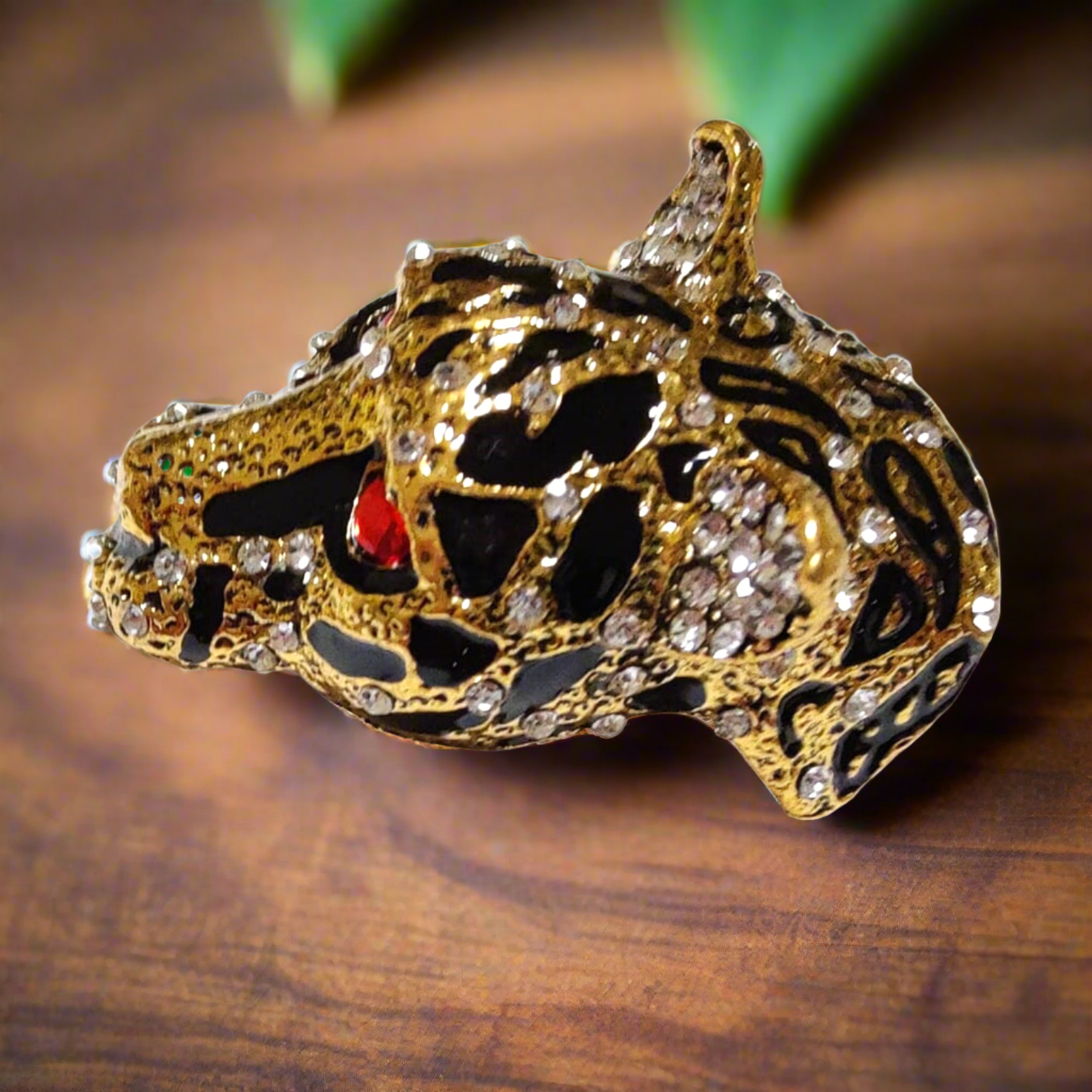 Leopard Head Lapel Pin worn at a formal event, showcasing its striking design.