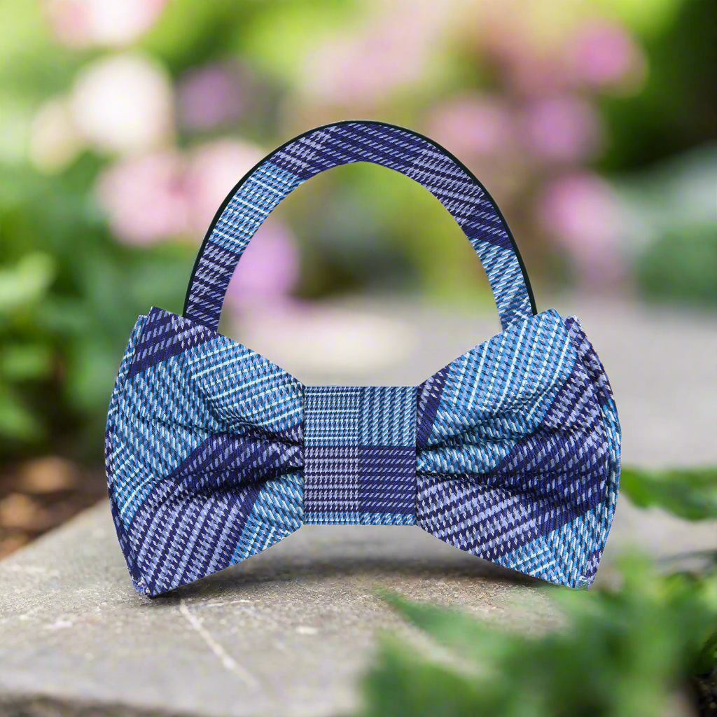 Silk bow tie paired with a navy suit, perfect for spring weddings and formal events