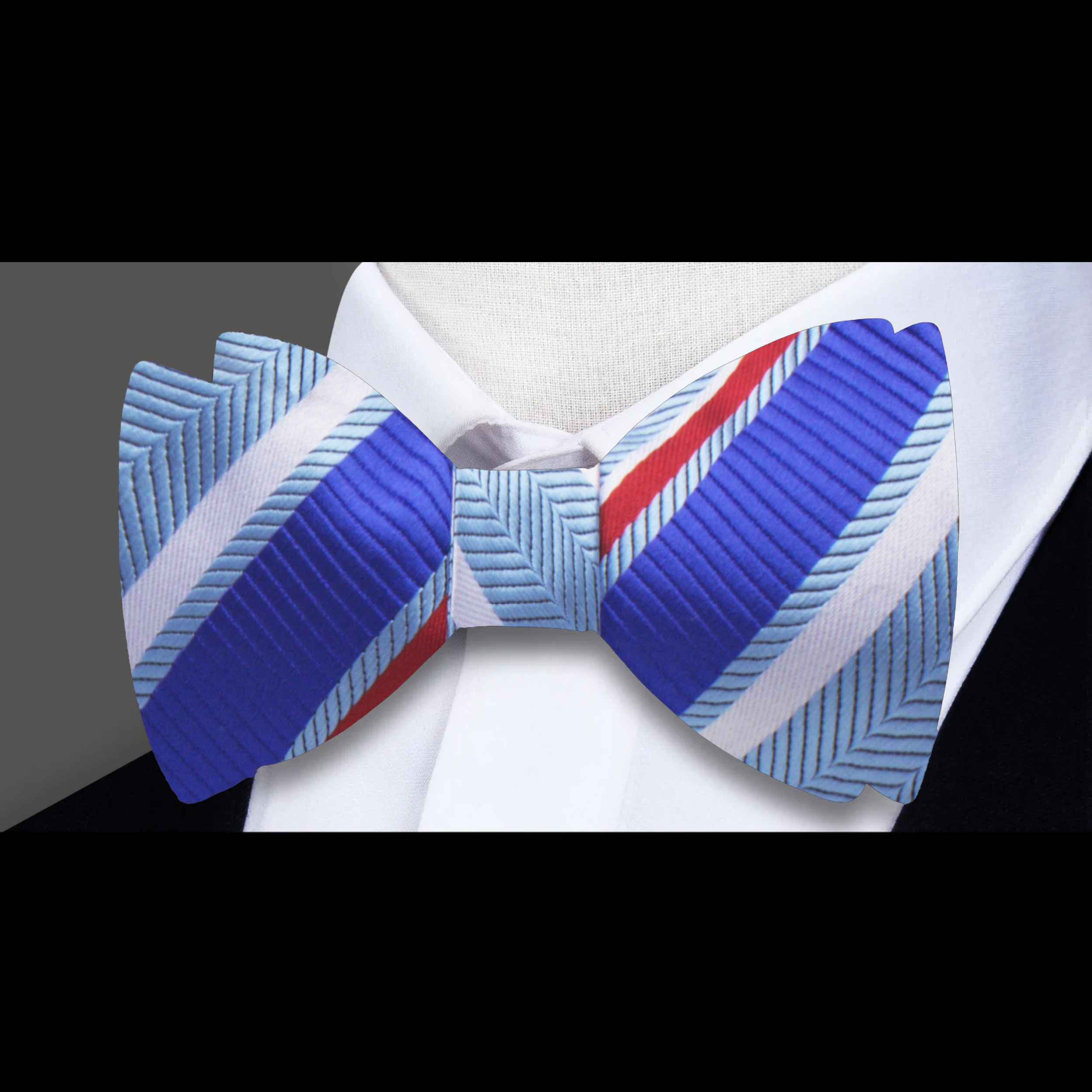 Close-up of the Delta Stripe Bow Tie in blue and orange, highlighting its elegant striped pattern.