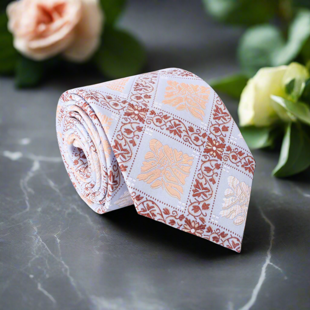 Front view of the Sistine silk necktie showcasing the light blue geometric design.