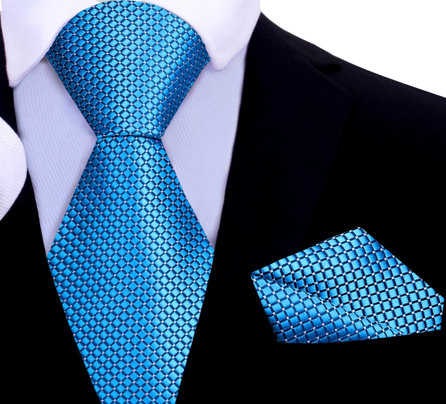 Silk tie with geometric pattern and metallic finish draped over a suit