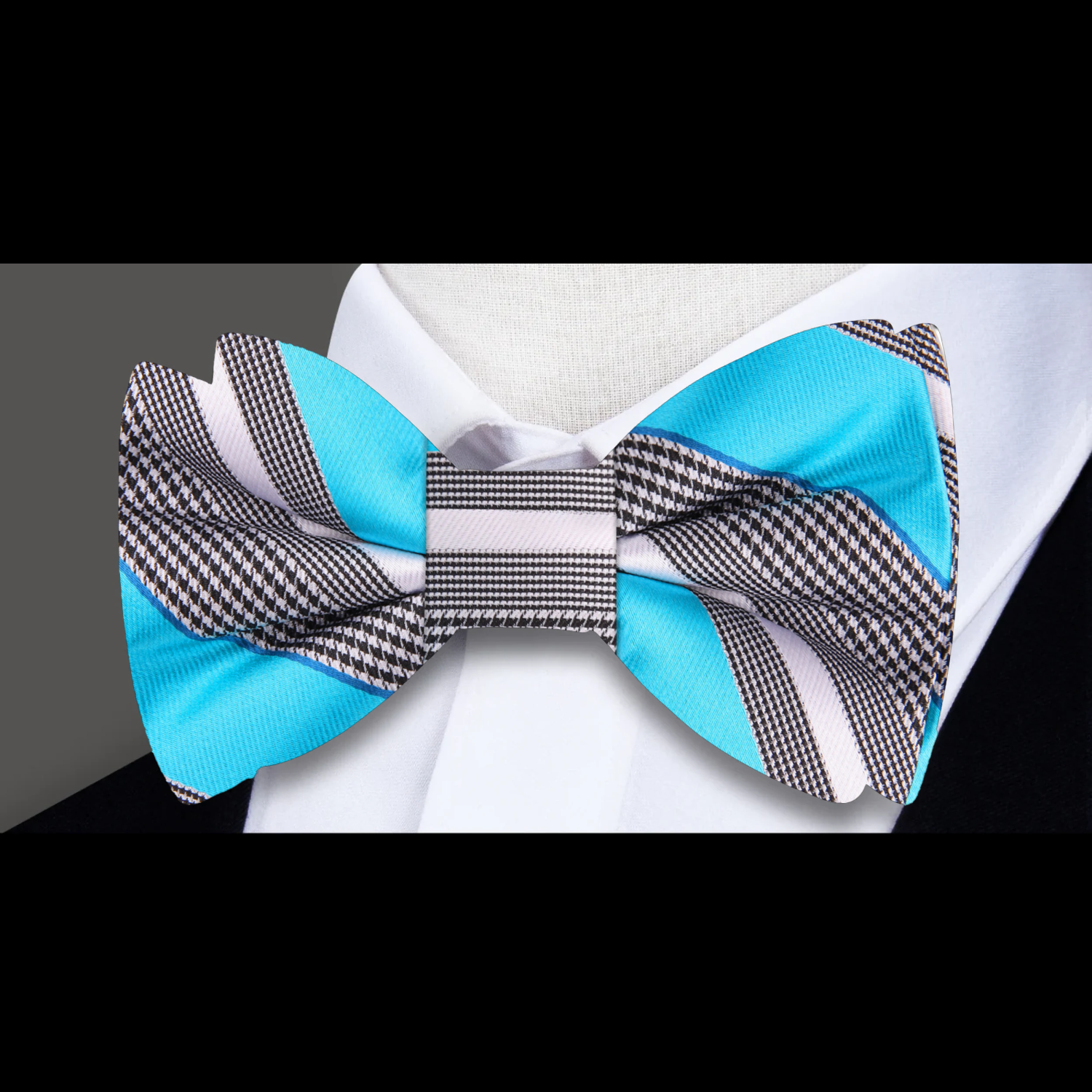 Stylish yellow striped bow tie on a display stand