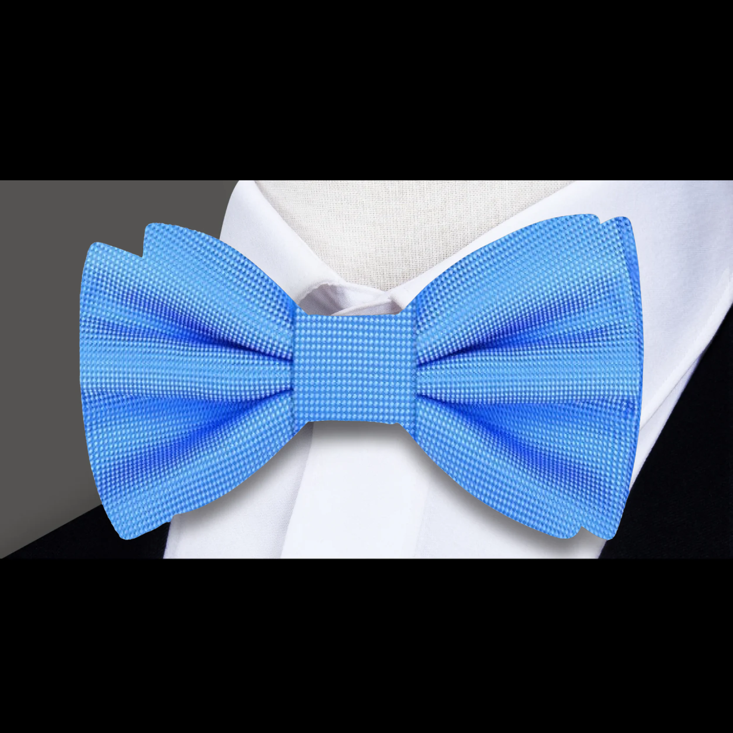 Matching pocket square with a navy blue bow tie, ideal for business meetings.