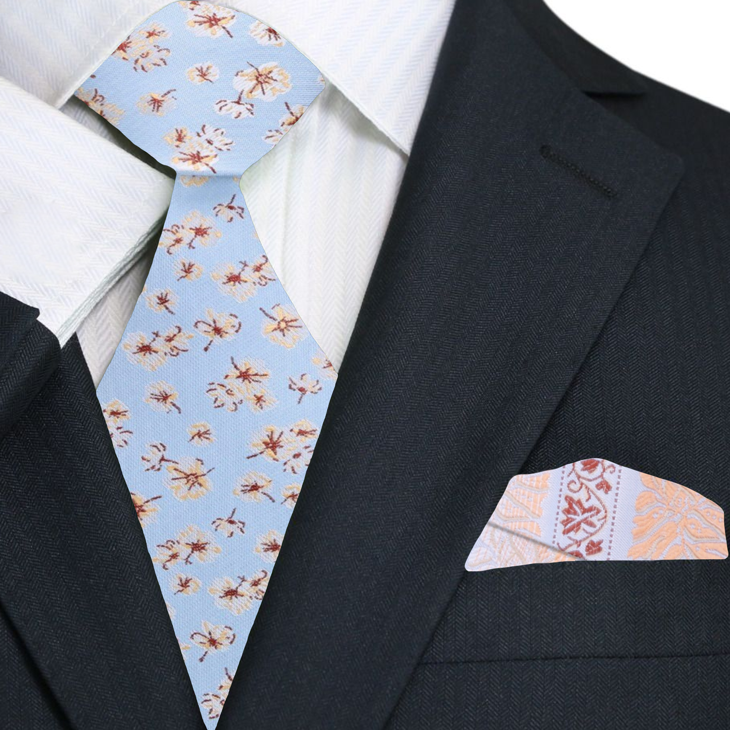 Groom wearing a light blue wedding tie with cream and burgundy floral design