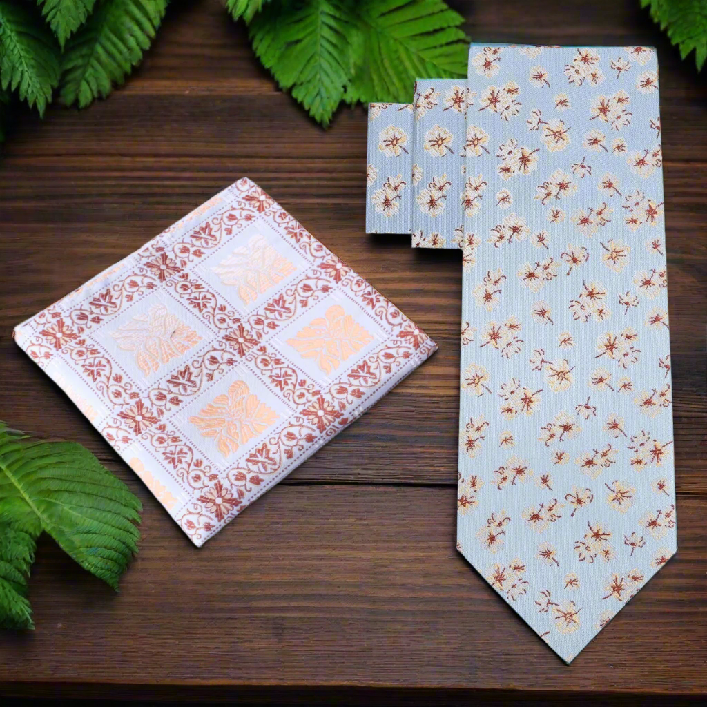 Close-up view of light blue silk floral tie showcasing intricate flower pattern