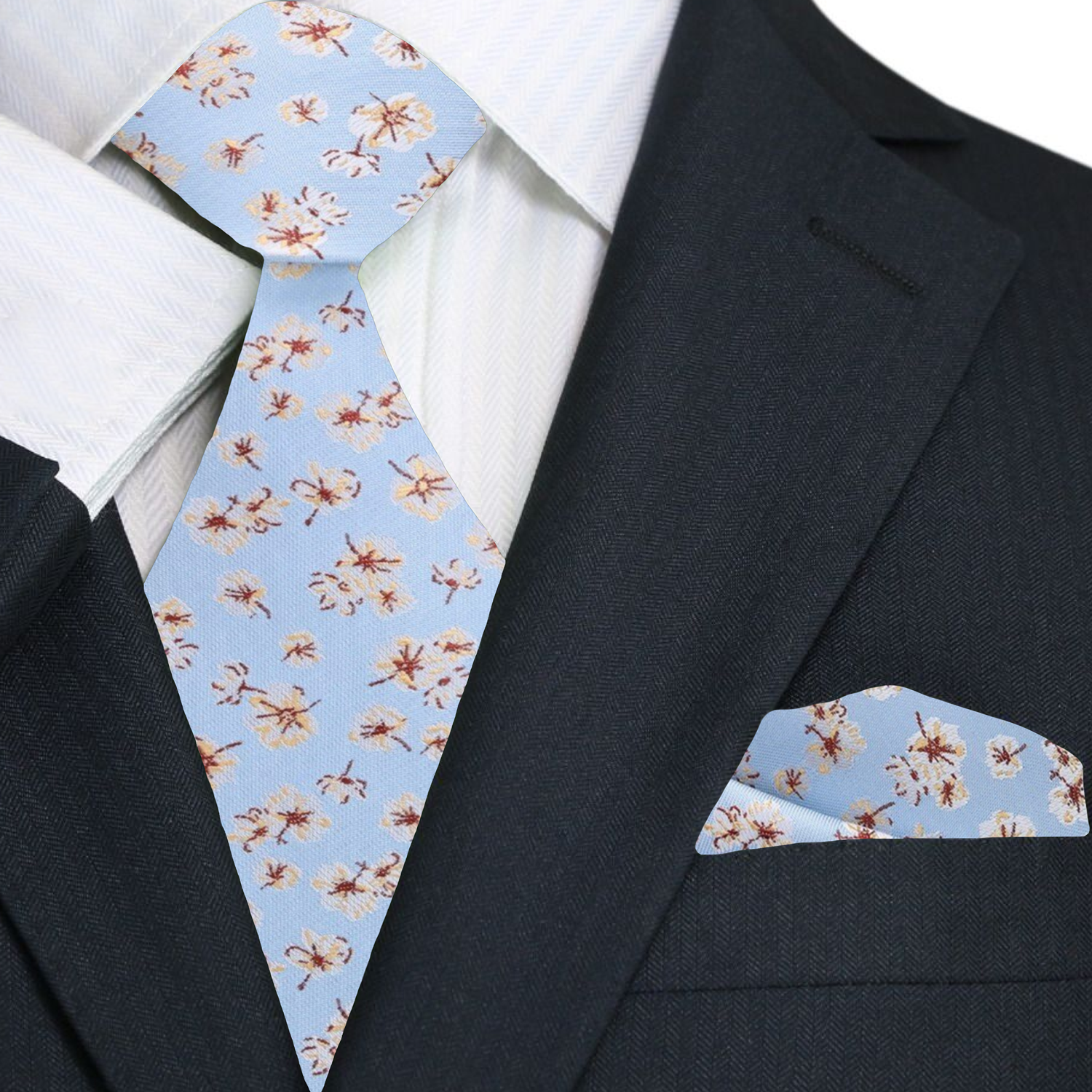 Groom wearing a light blue wedding tie with cream and burgundy floral design