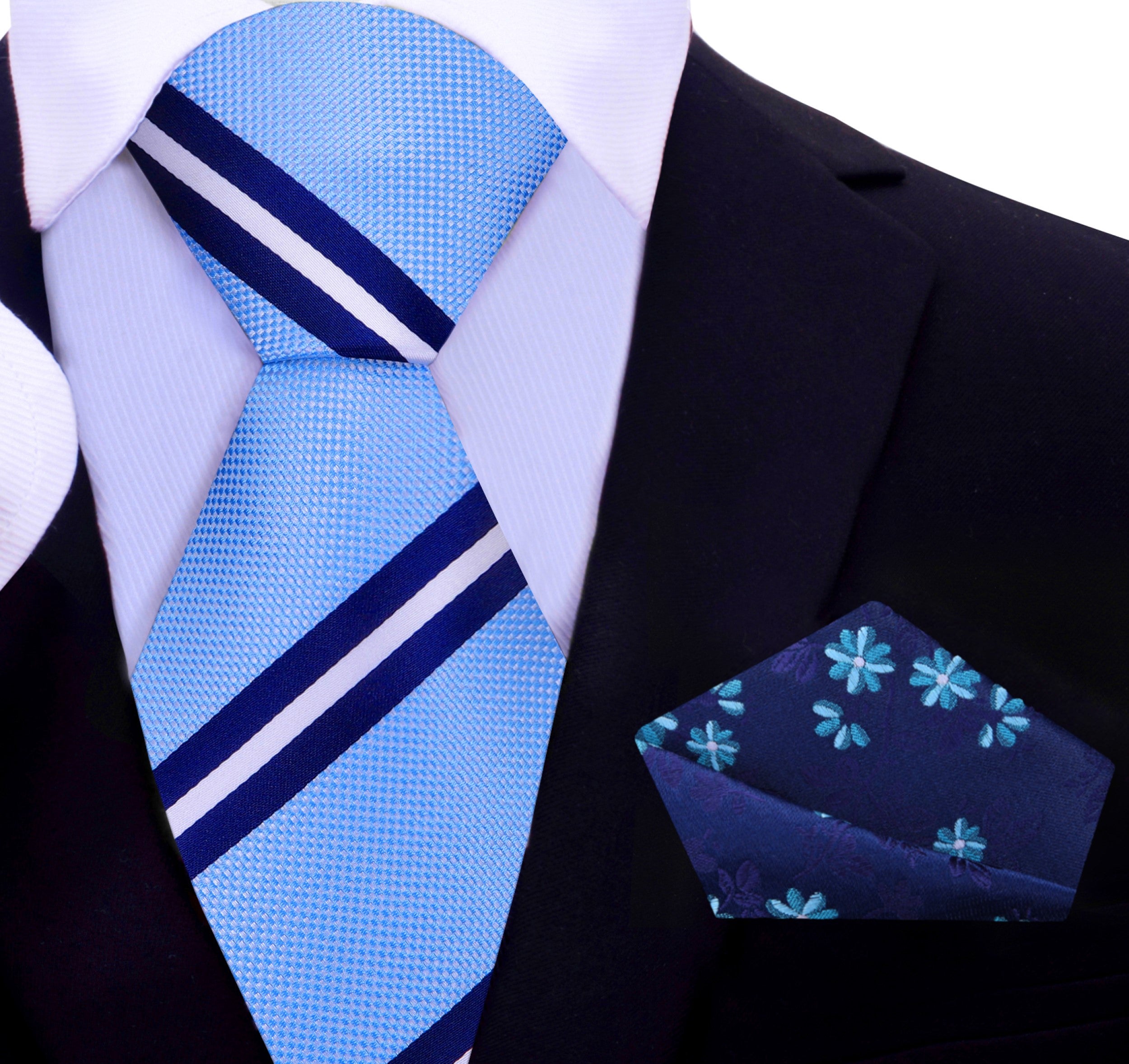 Model wearing the striped silk necktie with a navy suit, illustrating its versatility in formal settings.