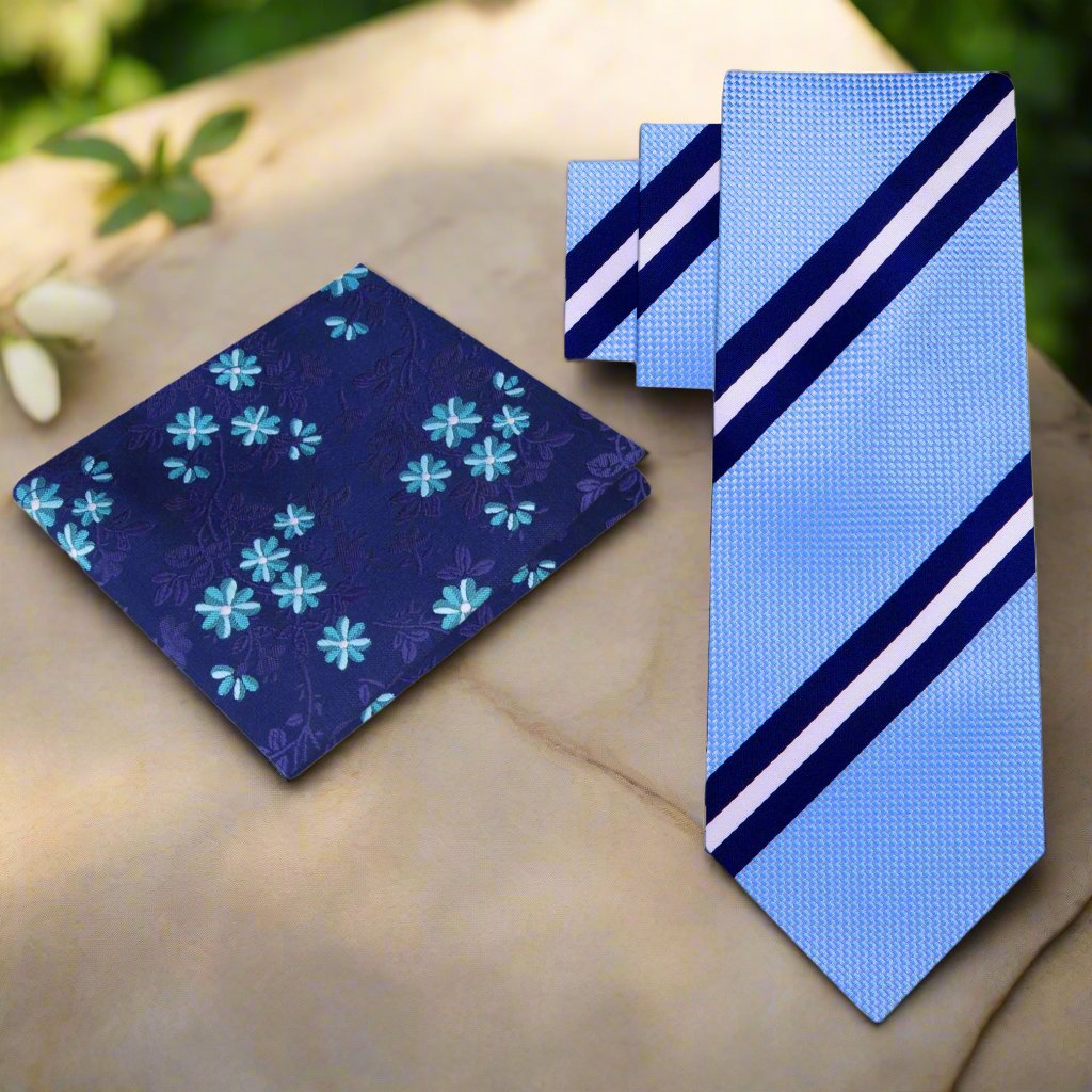 Close-up of the blue silk necktie showcasing the smooth texture and refined stripes.