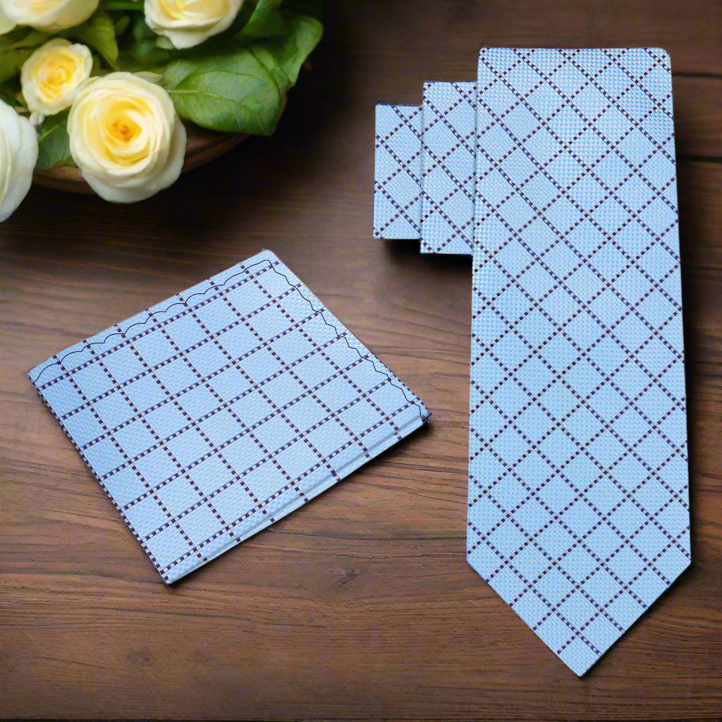 Mens wedding plaid necktie styled with a white shirt and navy suit