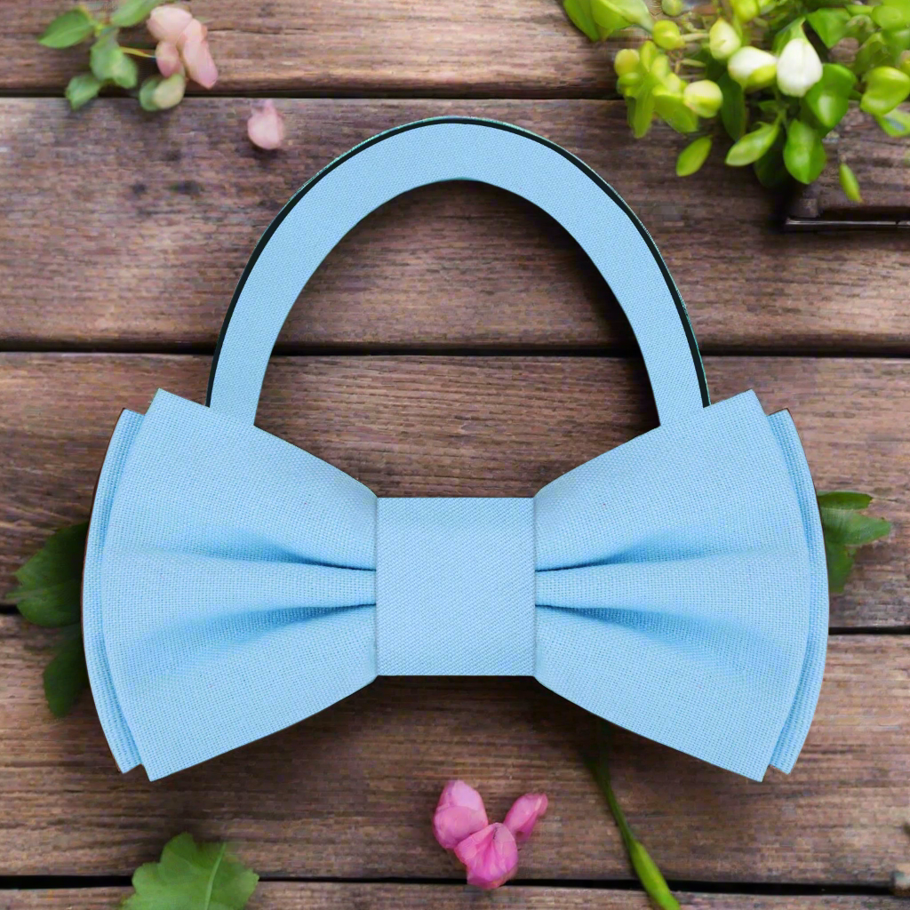 Fashionable man adjusting a deep red linen bow tie, showcasing effortless elegance
