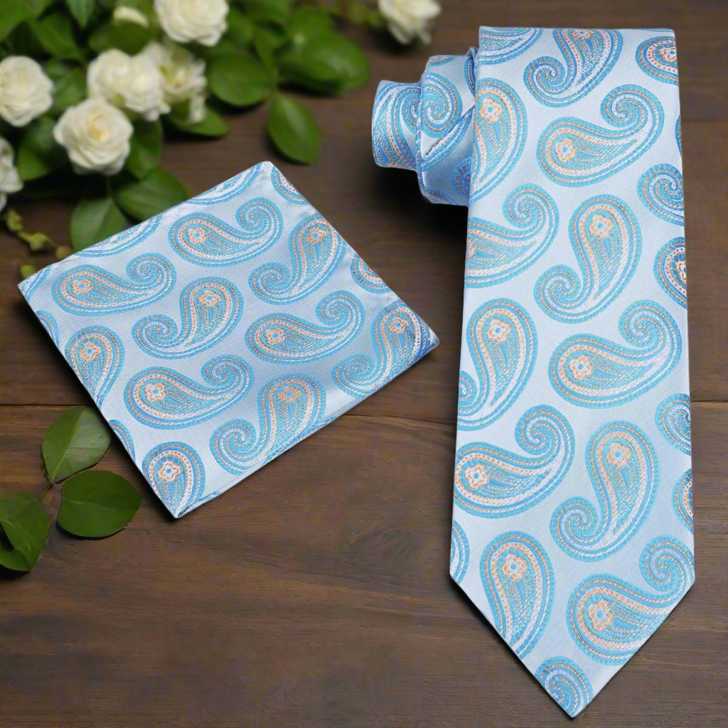 Full outfit shot featuring the aqua paisley tie with pocket square set styled with a navy suit for summer events.