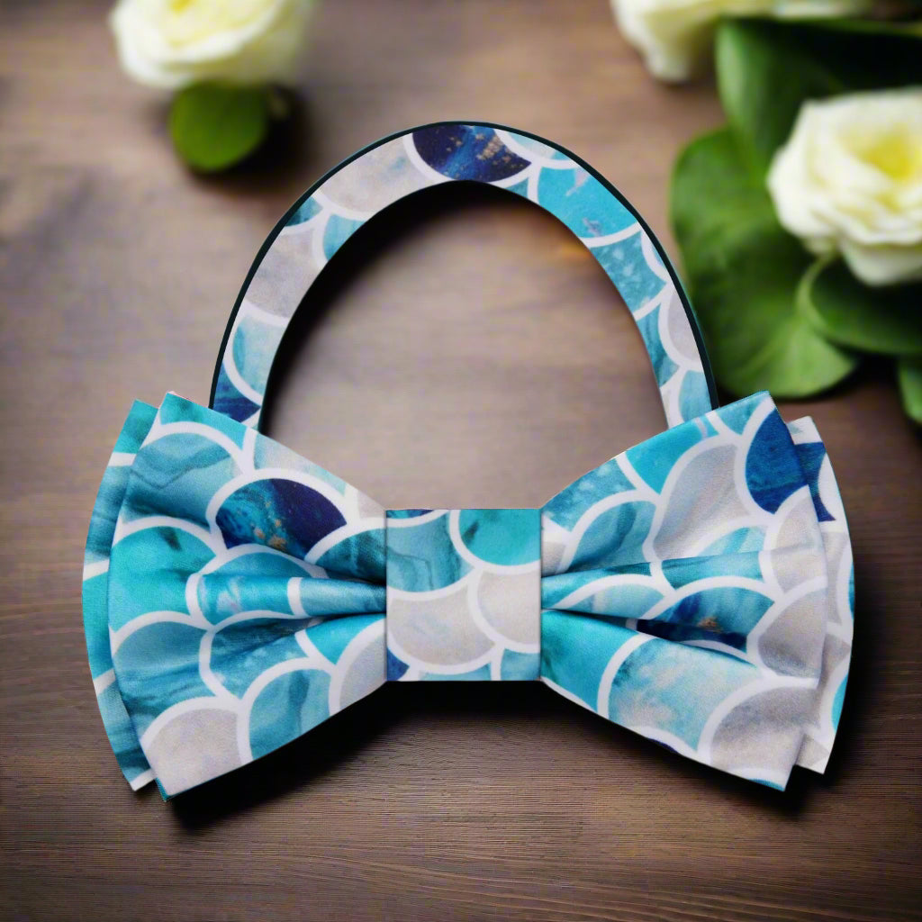 Adjustable blue bow tie for outdoor events, styled with a light grey suit.