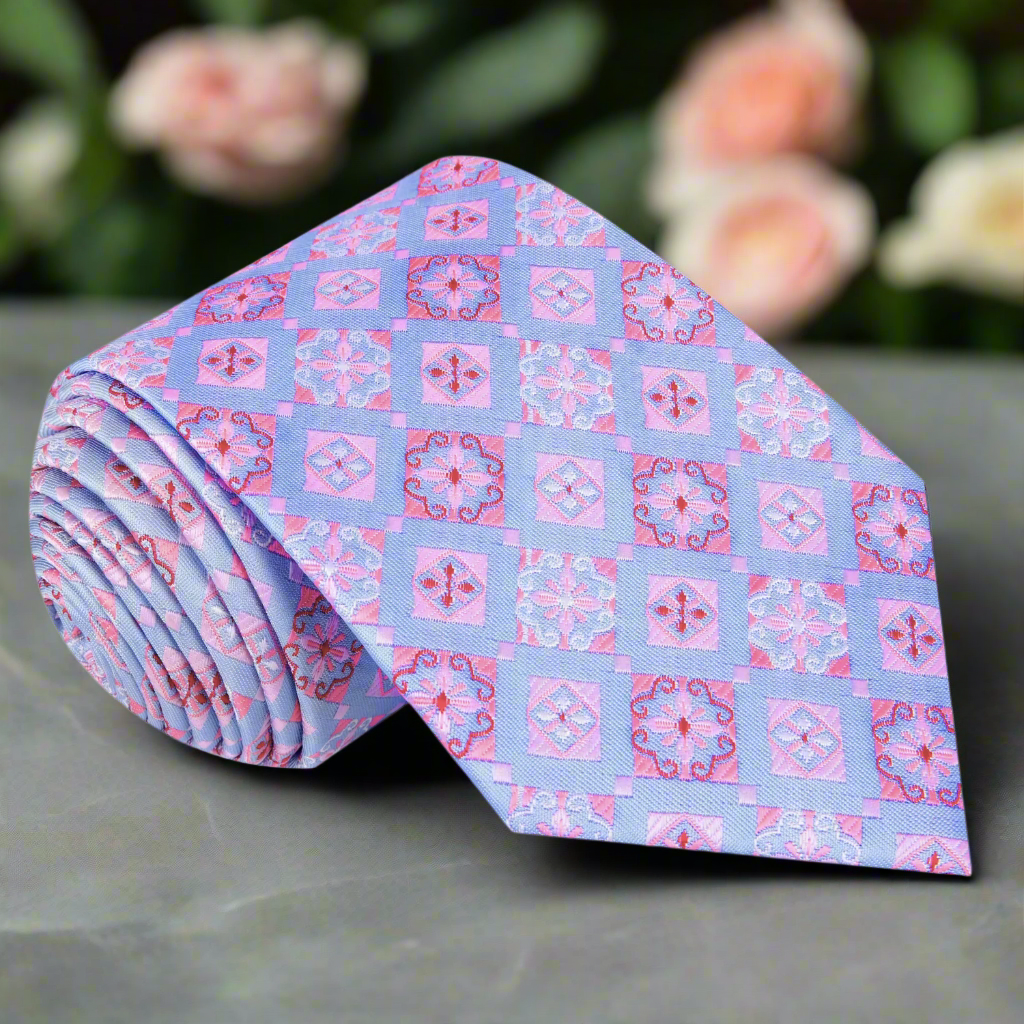 Close-up of geometric silk necktie in light blue and pink for business and wedding outfits