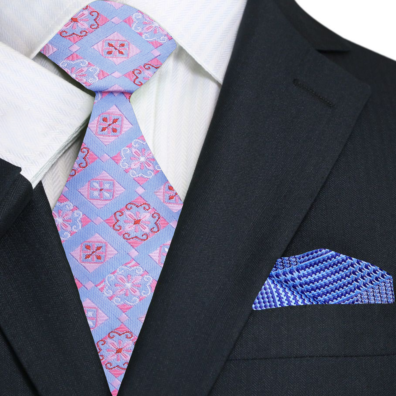 Man wearing geometric silk necktie with a navy suit at a formal event