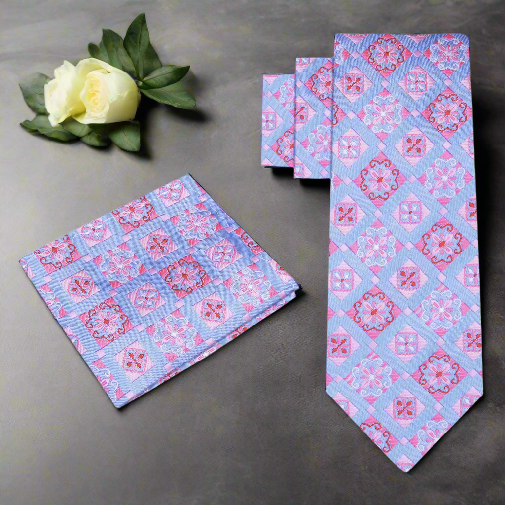 Man wearing geometric silk necktie with a navy suit at a formal event