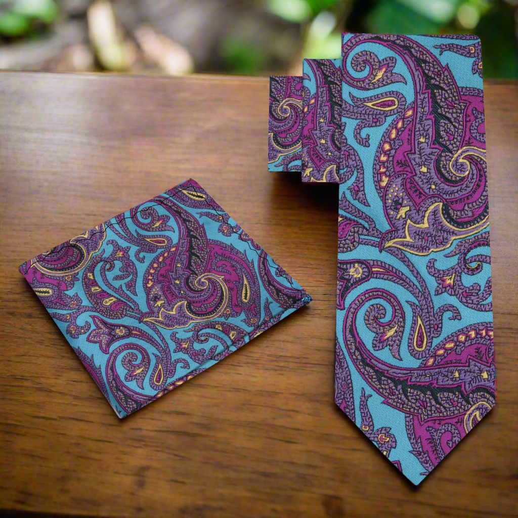 Styled mens paisley tie with white dress shirt and navy suit