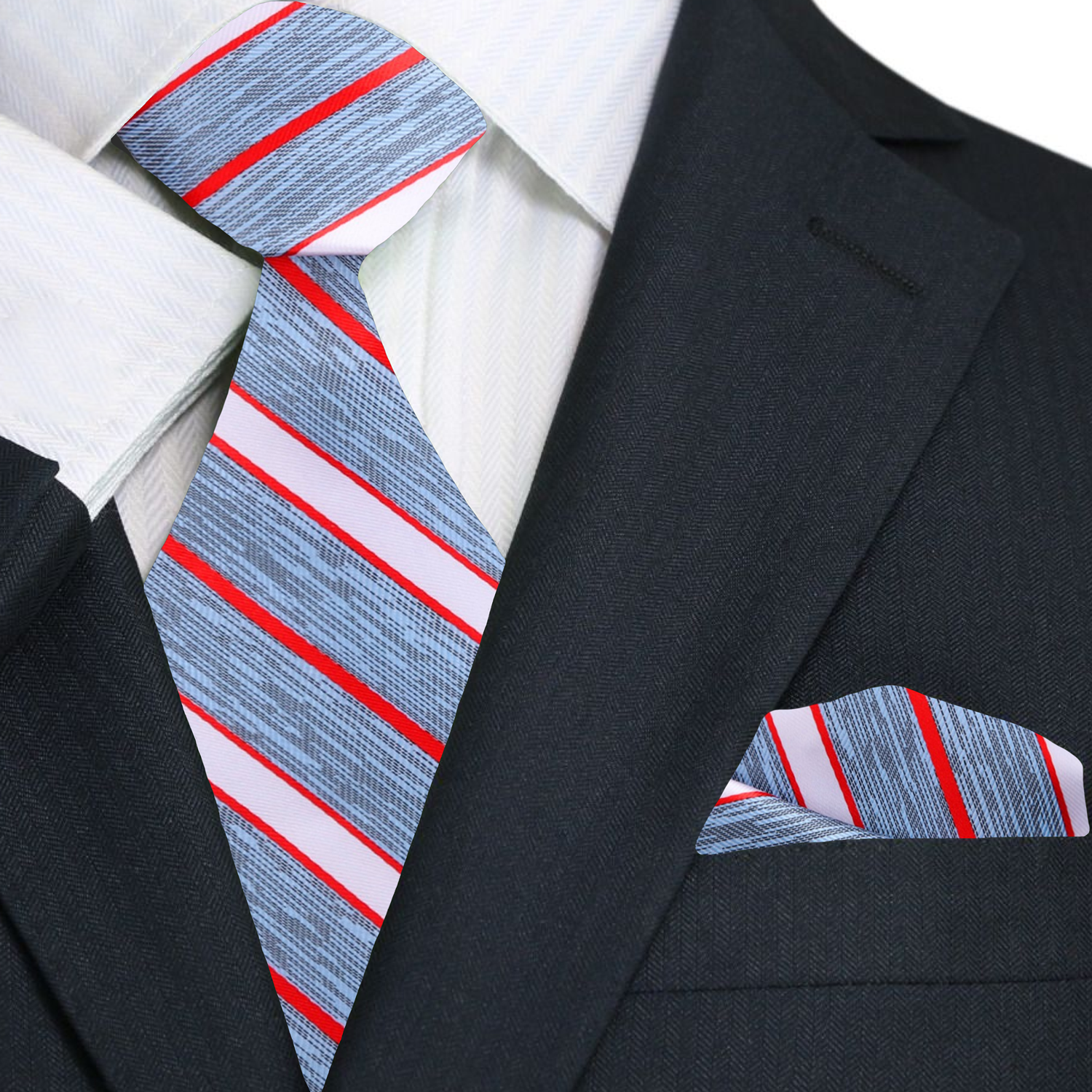 Model wearing the striped silk tie paired with a light blue shirt and navy suit.