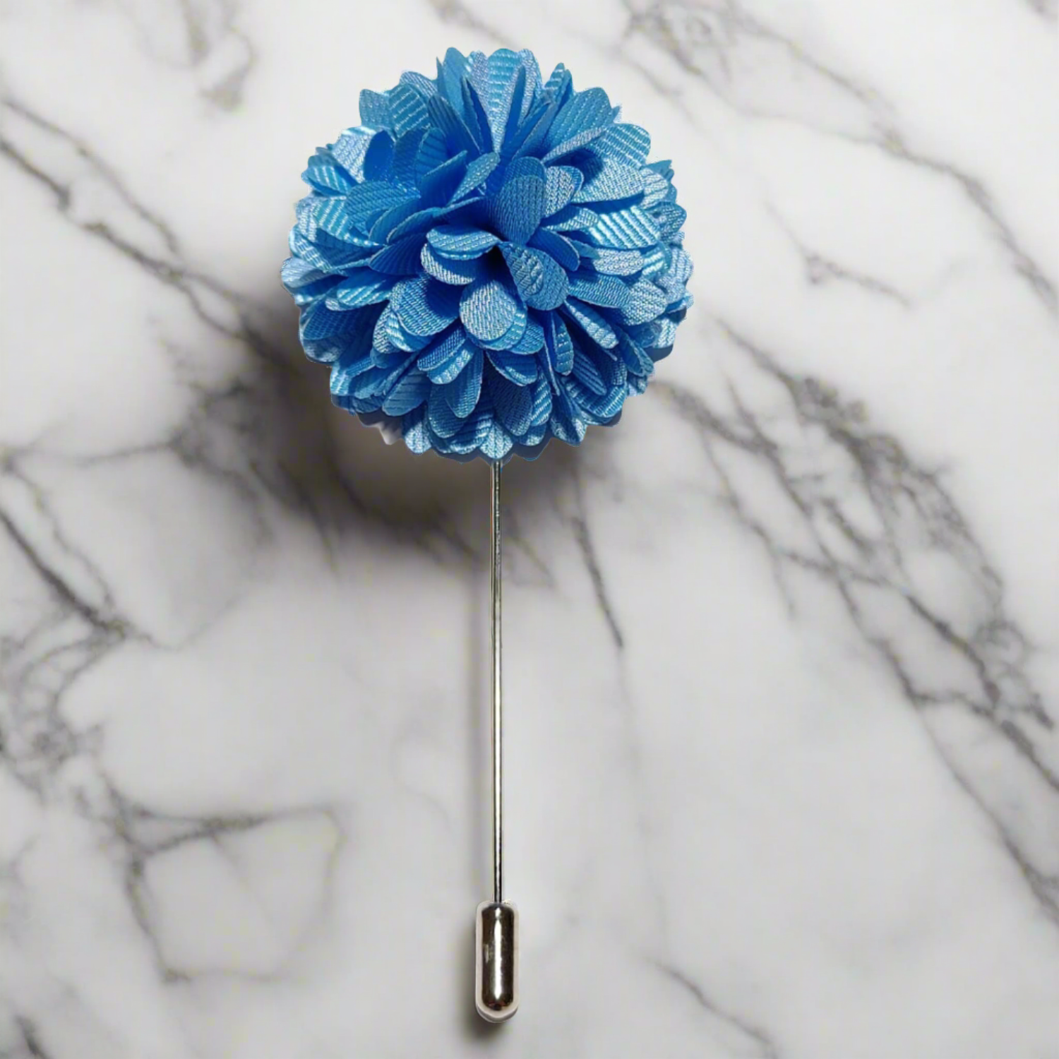 A close-up of the Regal Blossom lapel pin on a classic suit, highlighting its elegance.