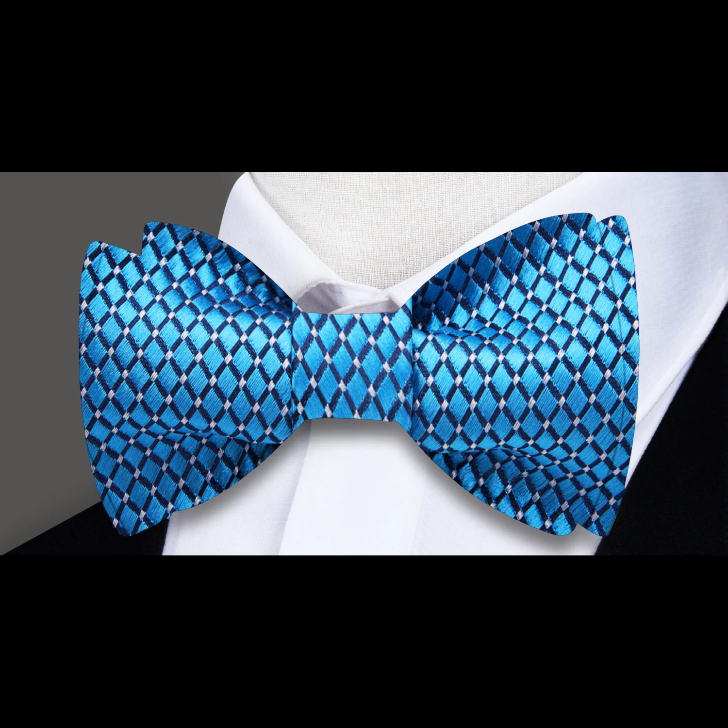 Elegant silk bow tie with small check pattern in gold and blue dots, ideal for weddings