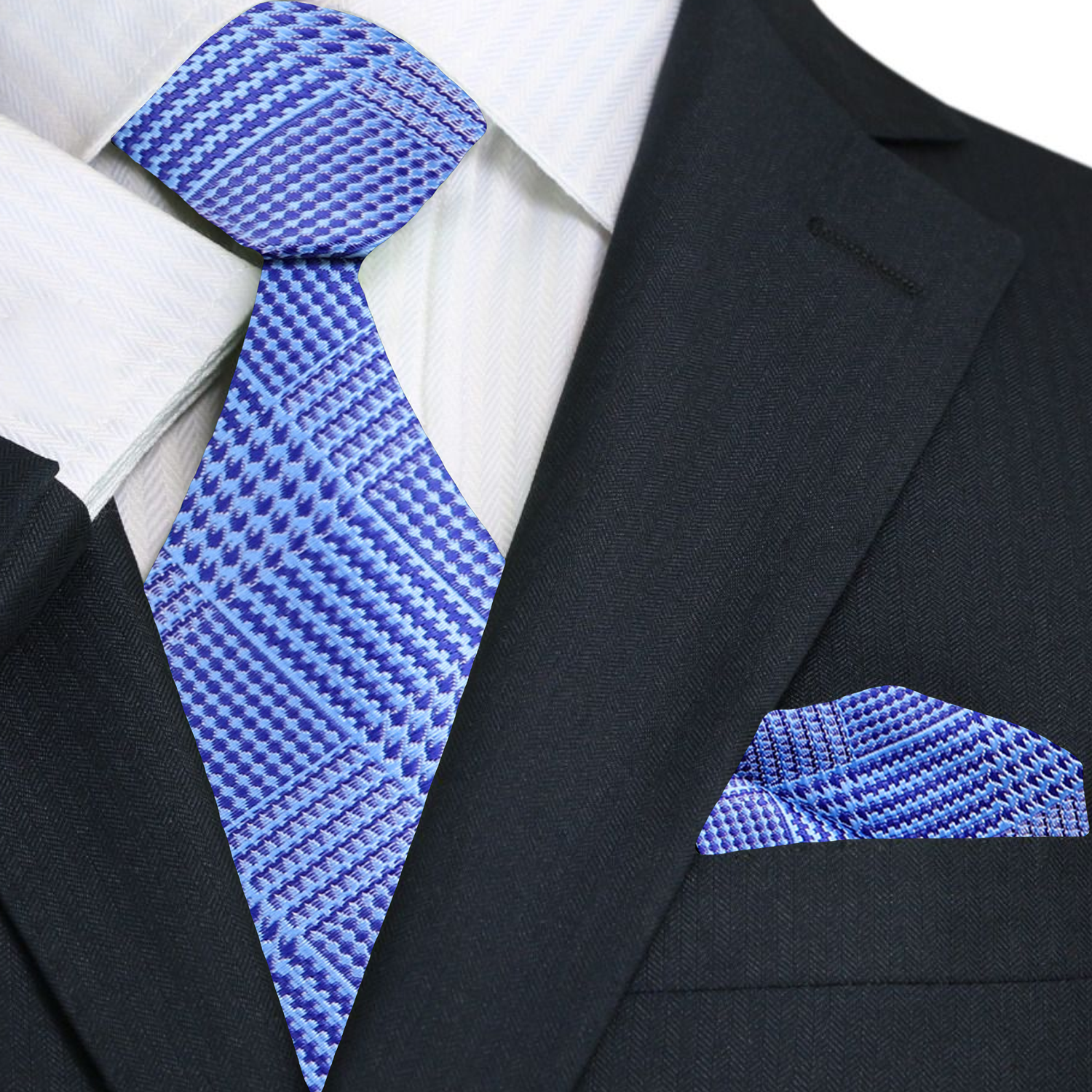 Light blue plaid silk necktie styled with a white dress shirt and navy suit