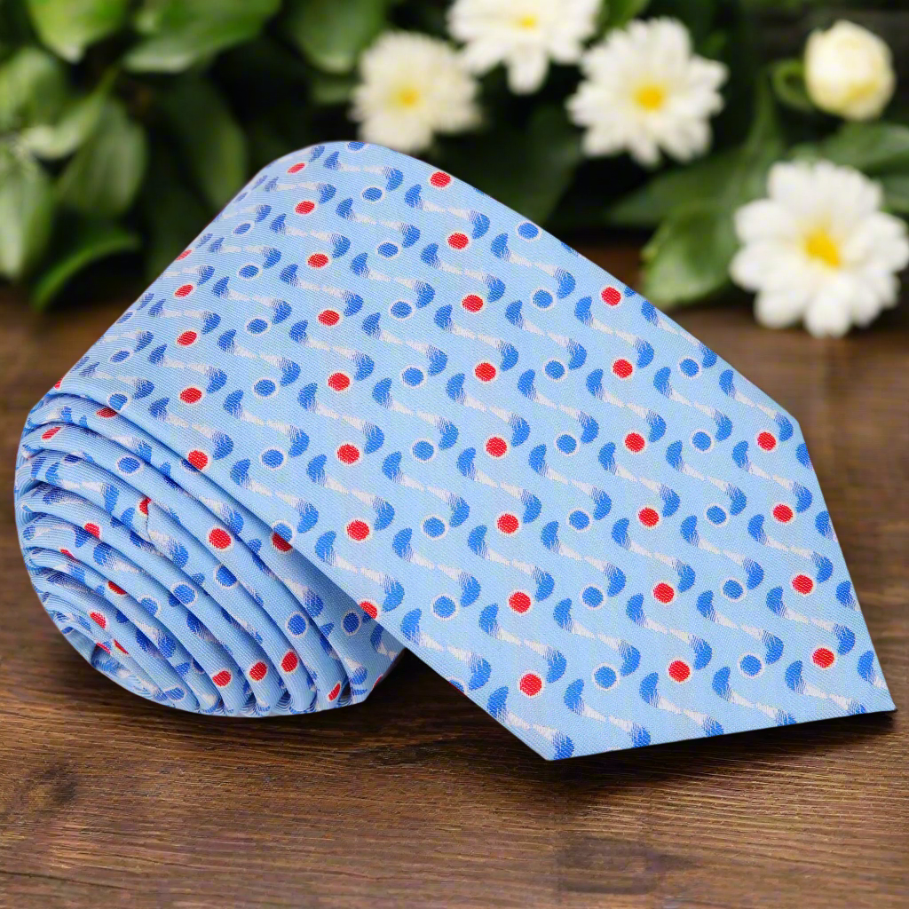 Close-up view of the light blue geometric necktie showcasing its intricate pattern.