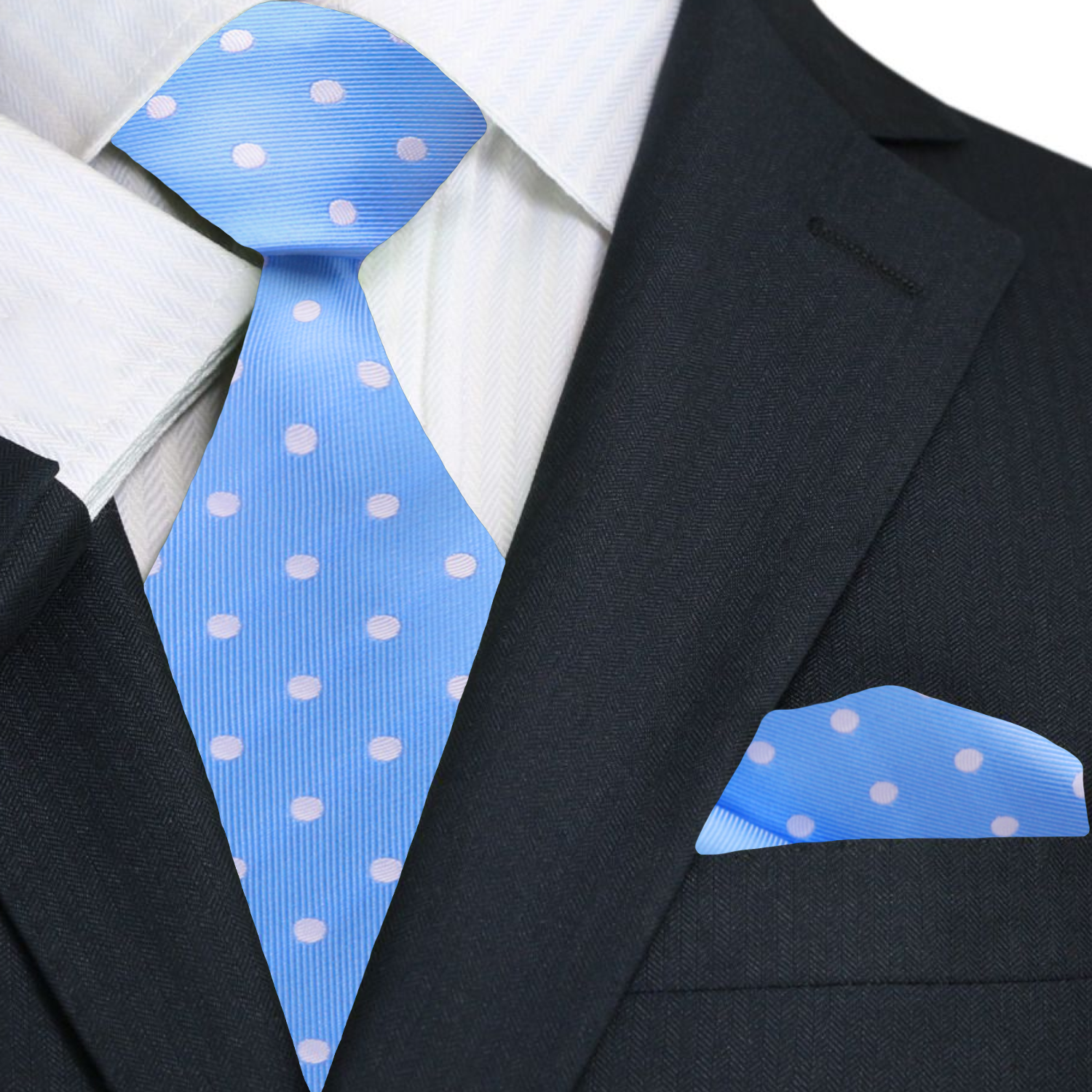 Light blue polka dot silk necktie draped over a dress shirt for wedding attire