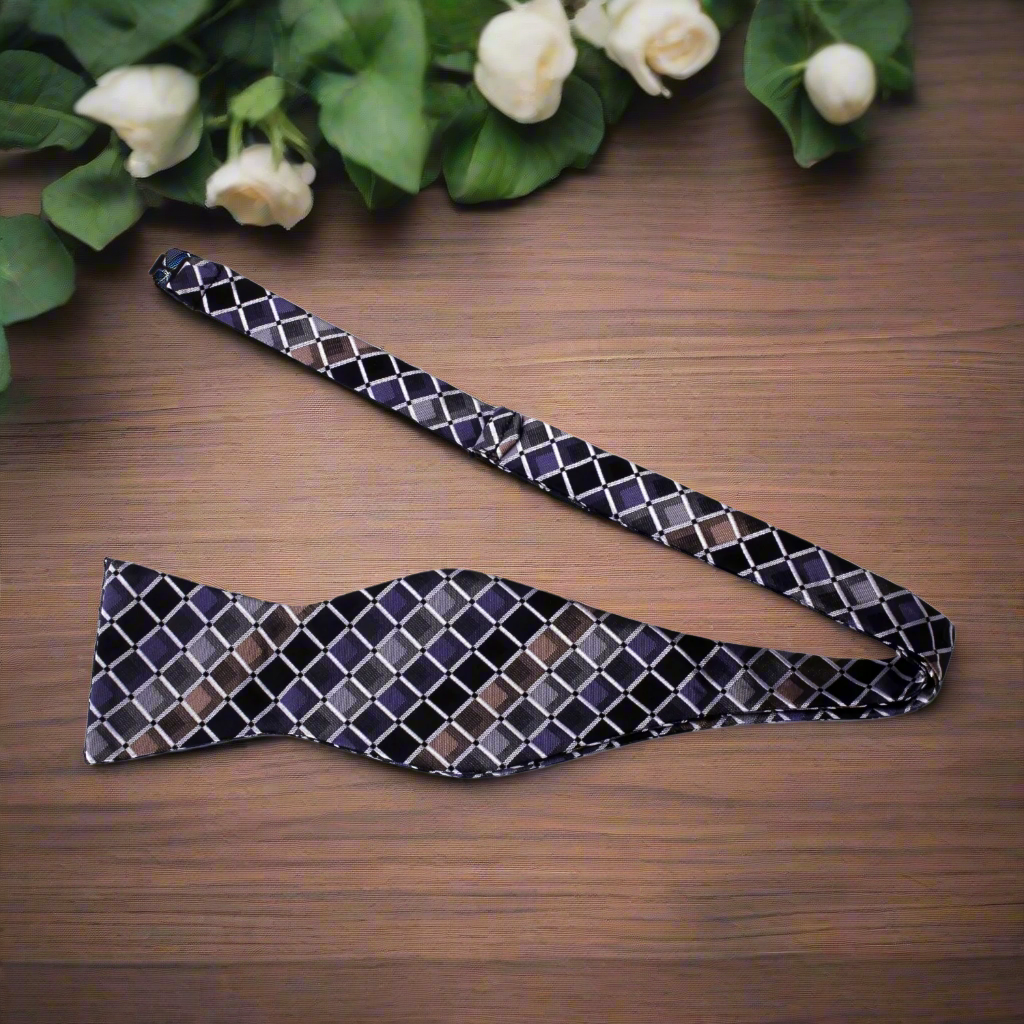 Close-up of the geometric pattern silk bow tie, showcasing vibrant colors and fine details
