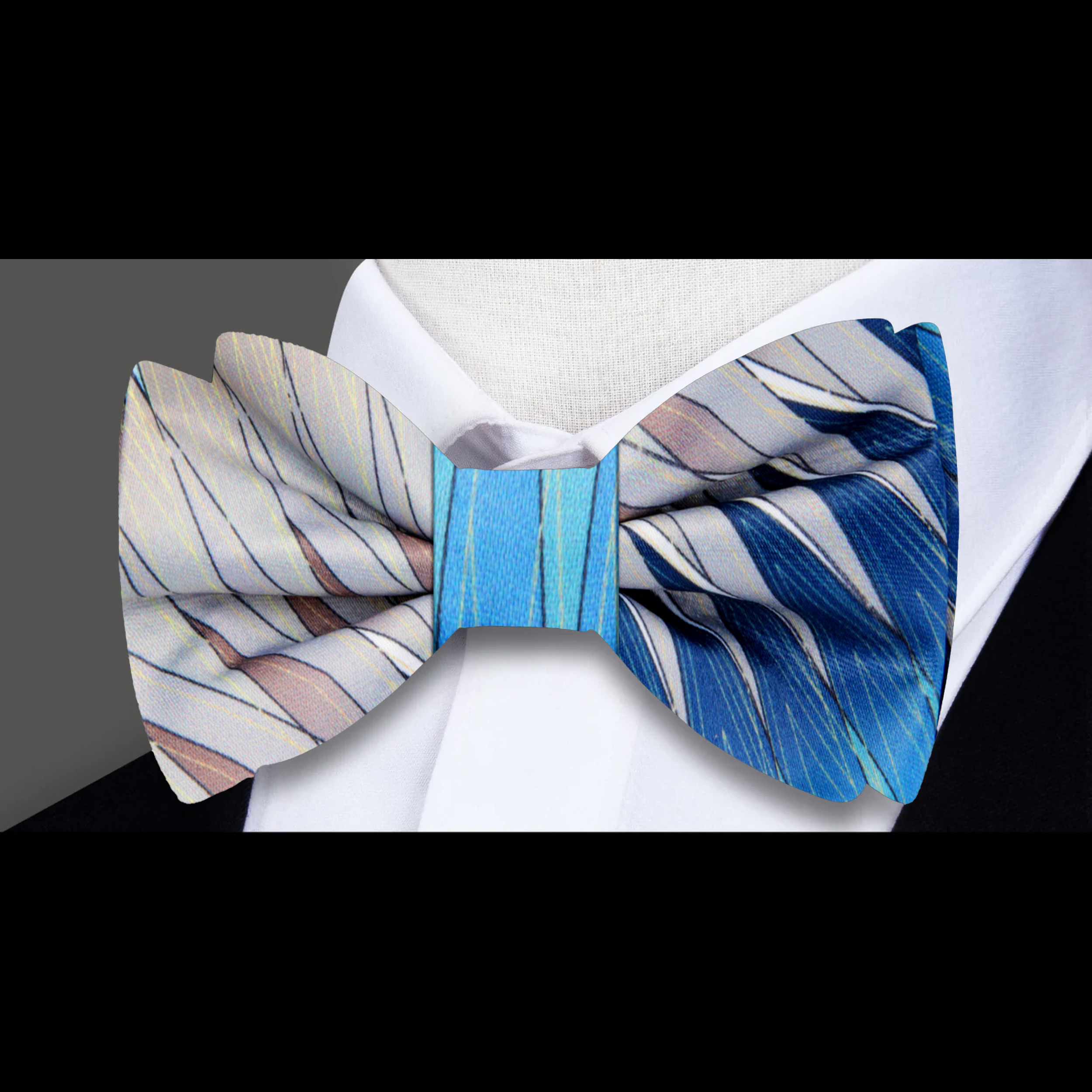 Fashionable man pairing dress bow tie with navy suit for sophisticated look