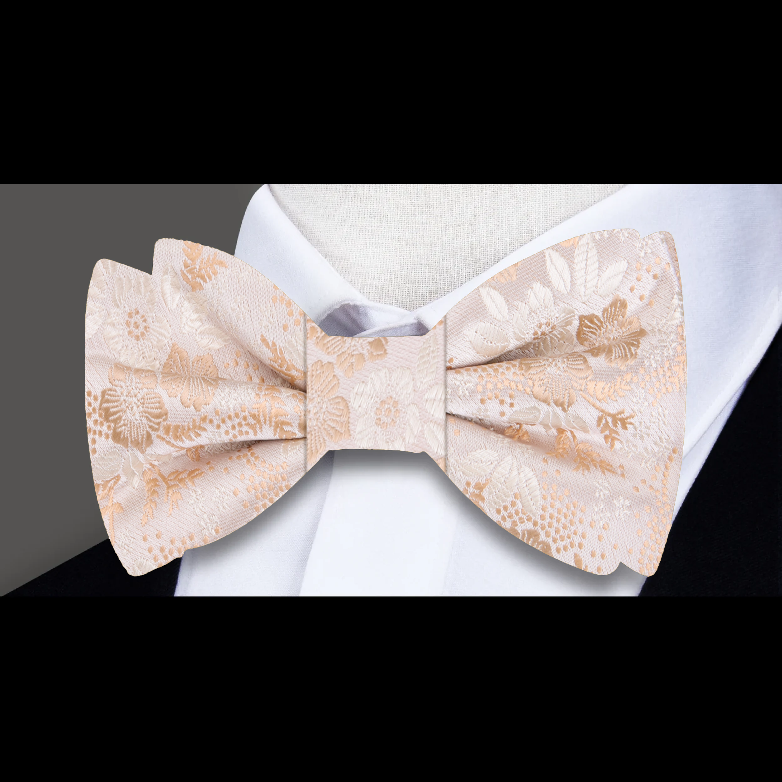Close-up of a mens floral bow tie featuring intricate flower patterns in vibrant colors.