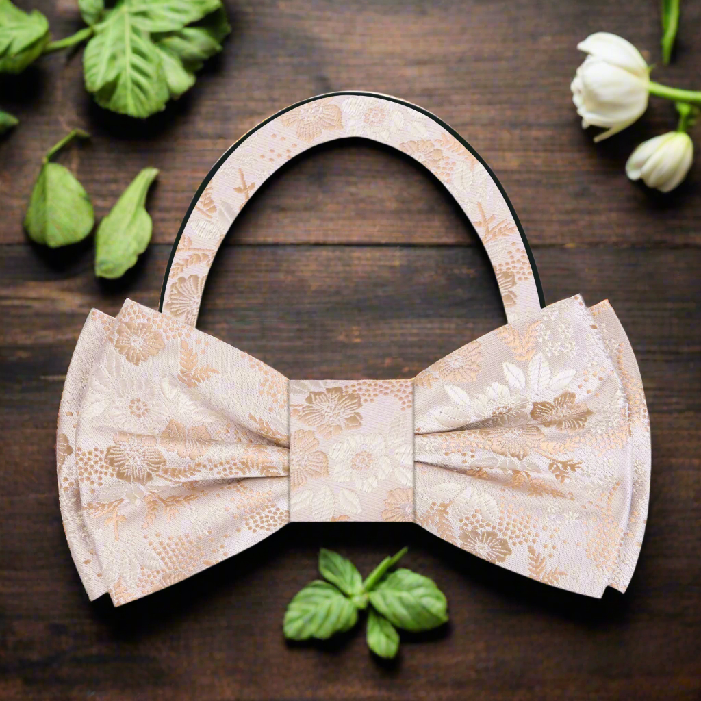 Stylish man wearing a floral bow tie with a crisp white dress shirt at a garden wedding.