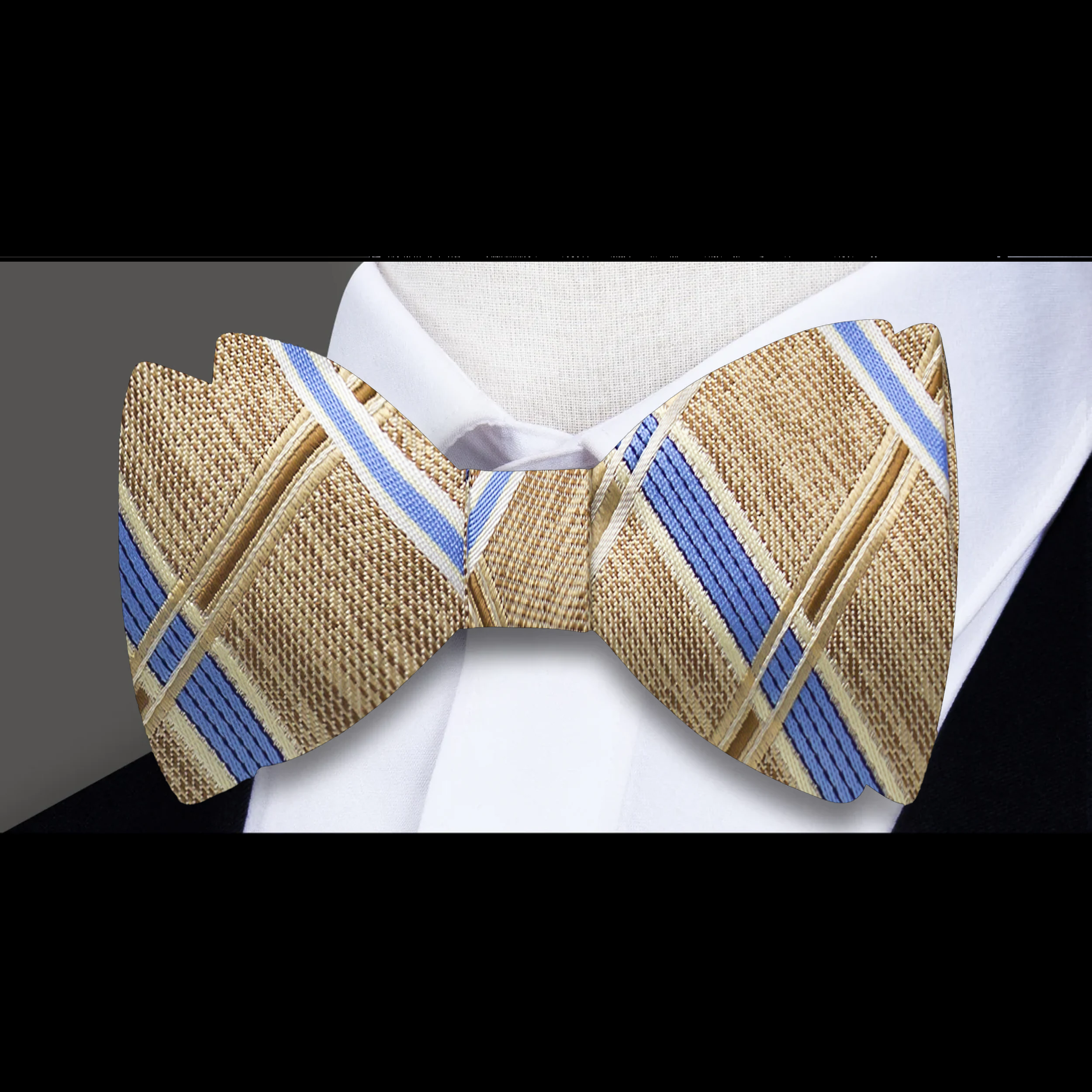 Close-up of the intricate plaid design of the silk bow tie against a light background.