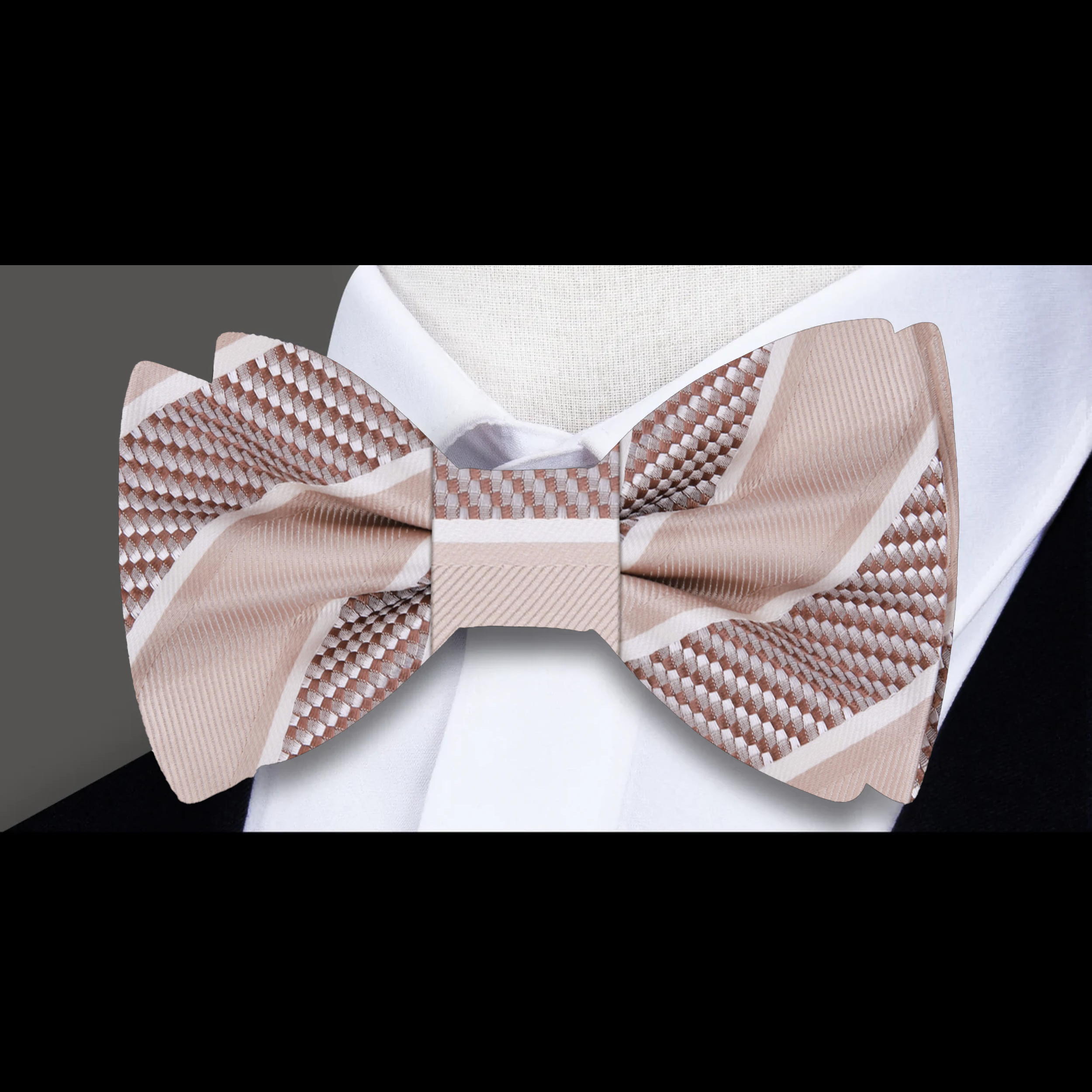 Close-up of the fabric pattern and texture of a yellow gold striped bow tie