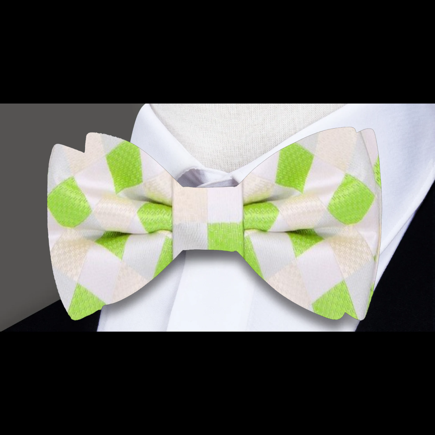 Close-up view of the yellow and blue plaid pattern in a silk bow tie.