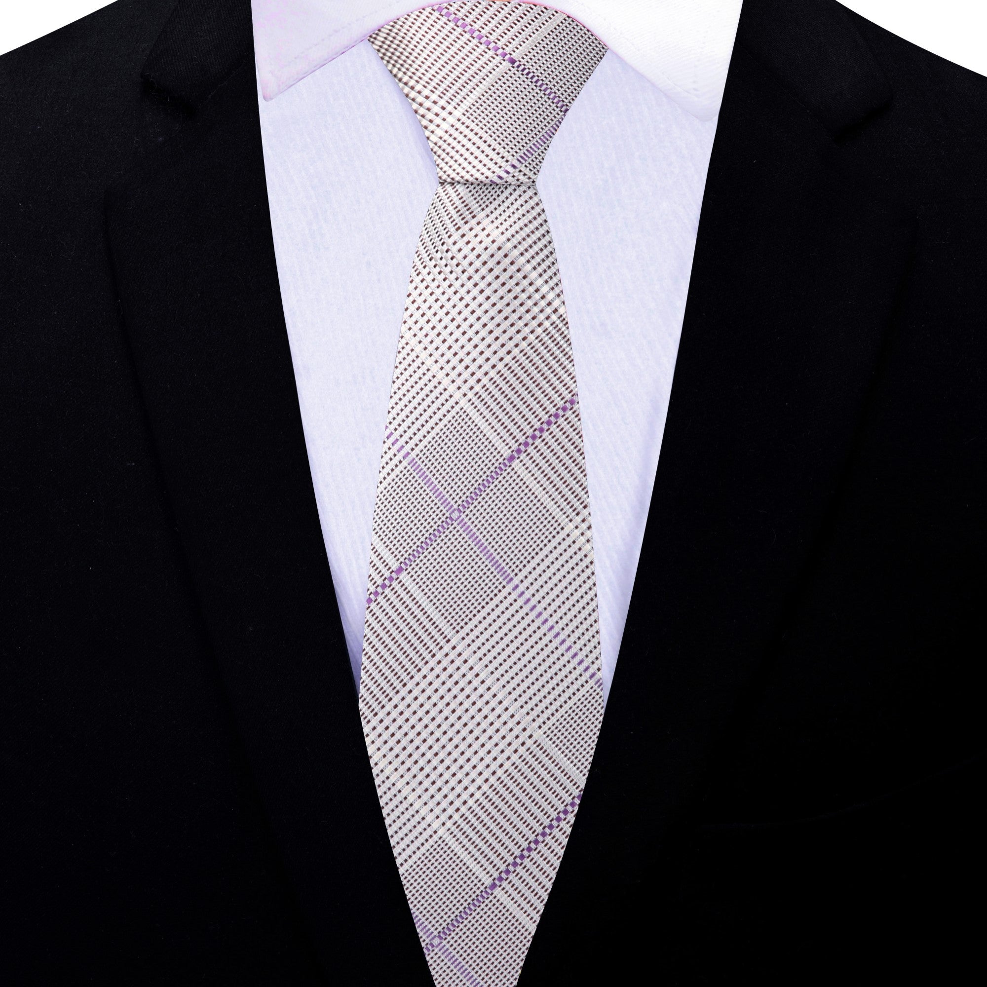 Close-up of grey and purple silk plaid necktie folded neatly with pocket square