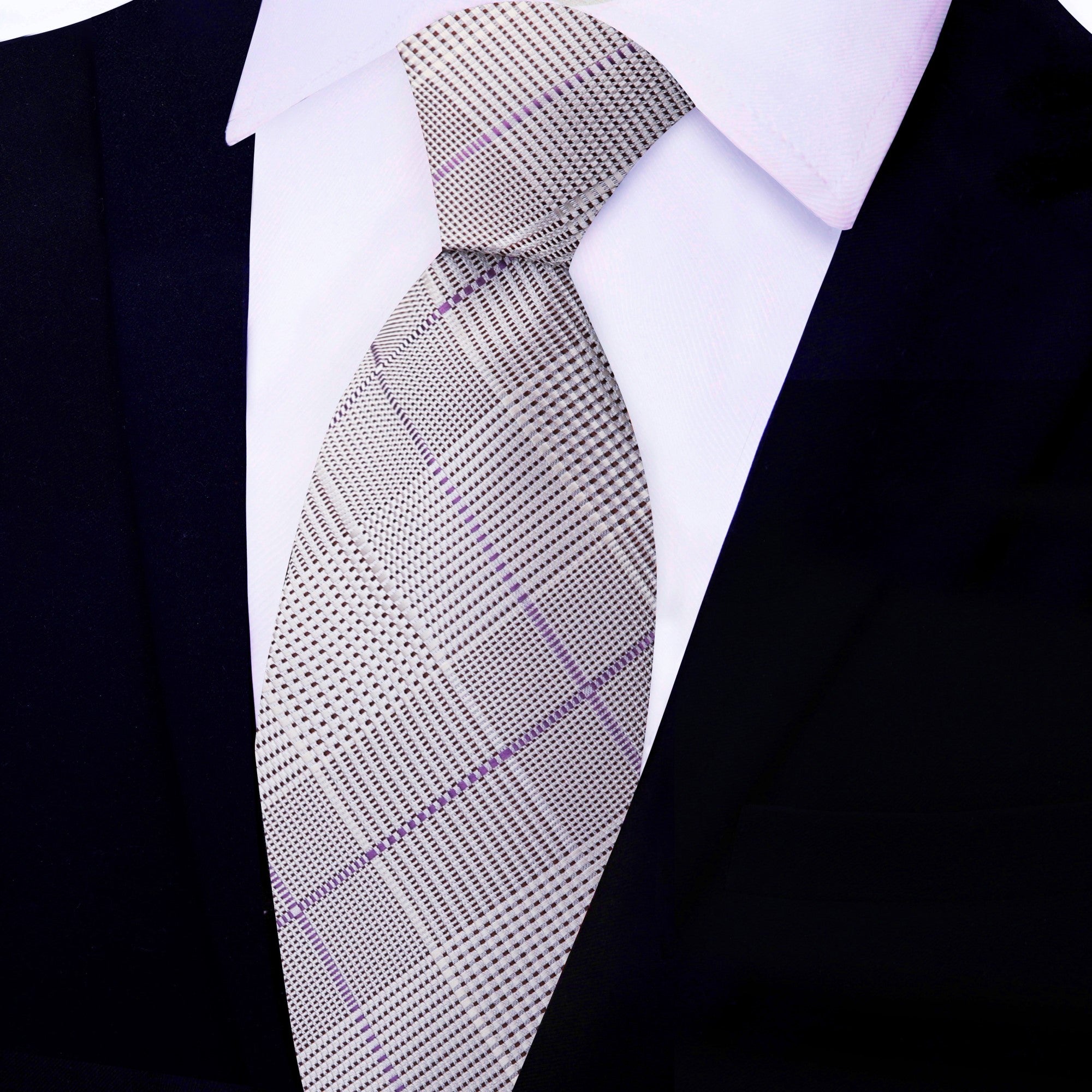 Grey plaid necktie styled with a charcoal suit and white shirt—ideal for weddings