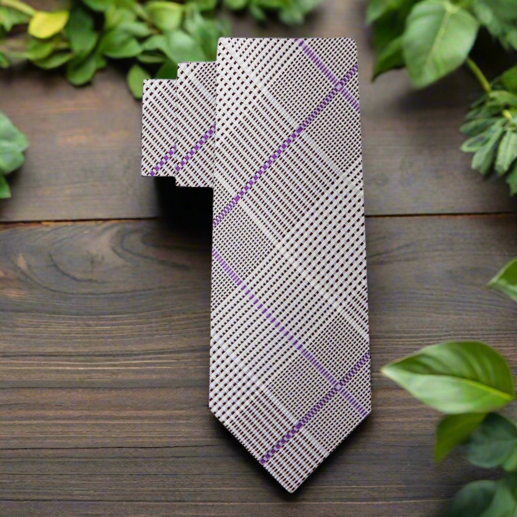 Purple plaid silk tie paired with navy pinstripe suit for business presentation