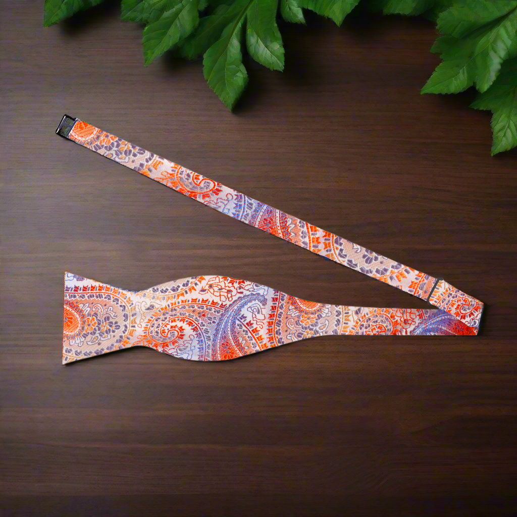 Elegant blue paisley bow tie paired with white dress shirt